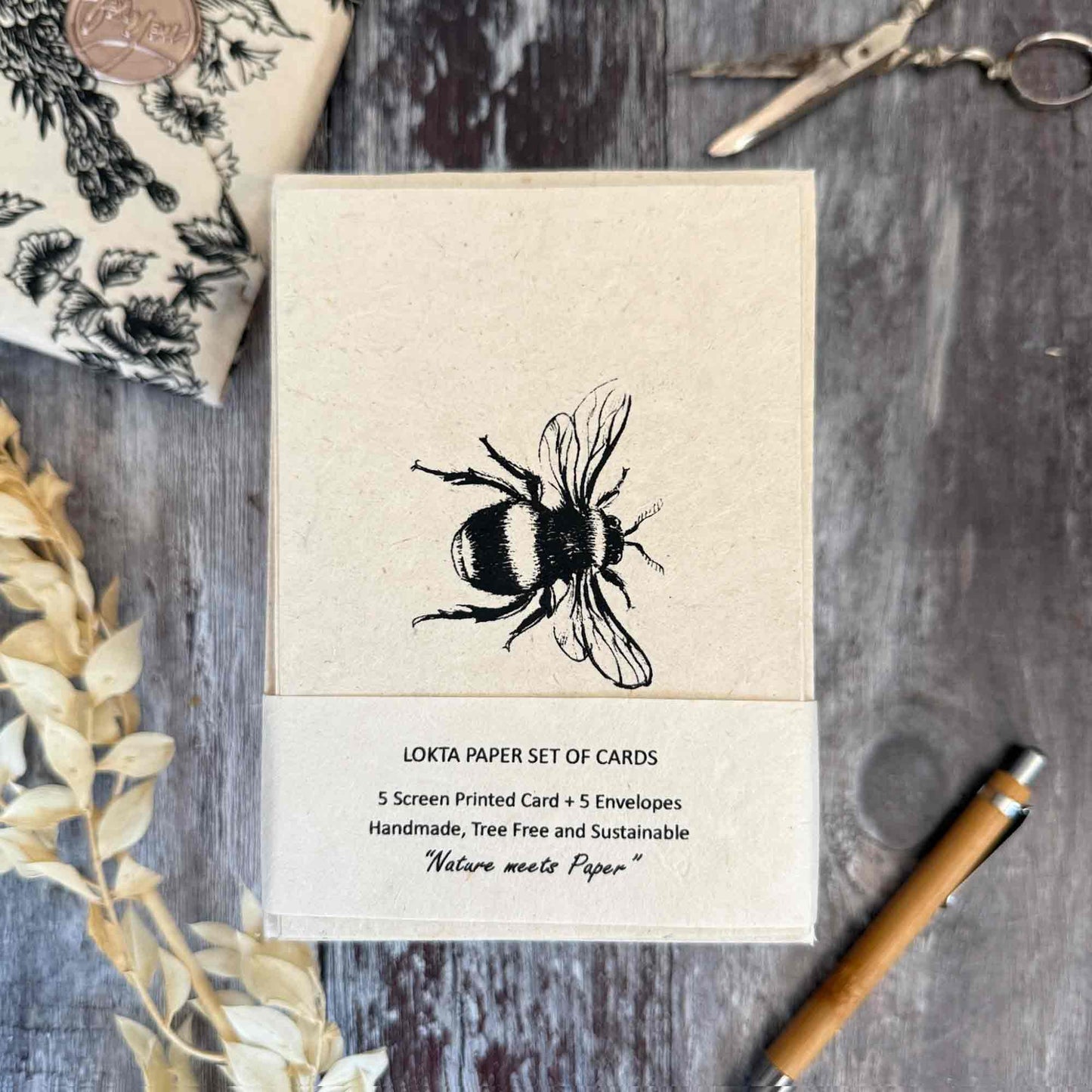 Eco-friendly Lokta paper cards featuring bumble bee art, handmade and sustainable packaging