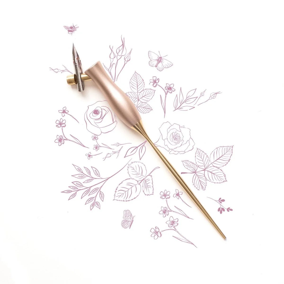 Bloom Calligraphy pen by Tom's Studio.  A pink pen with a brass handle.  Oblique style calligraphy pen suitable for right or left handed calligraphers.