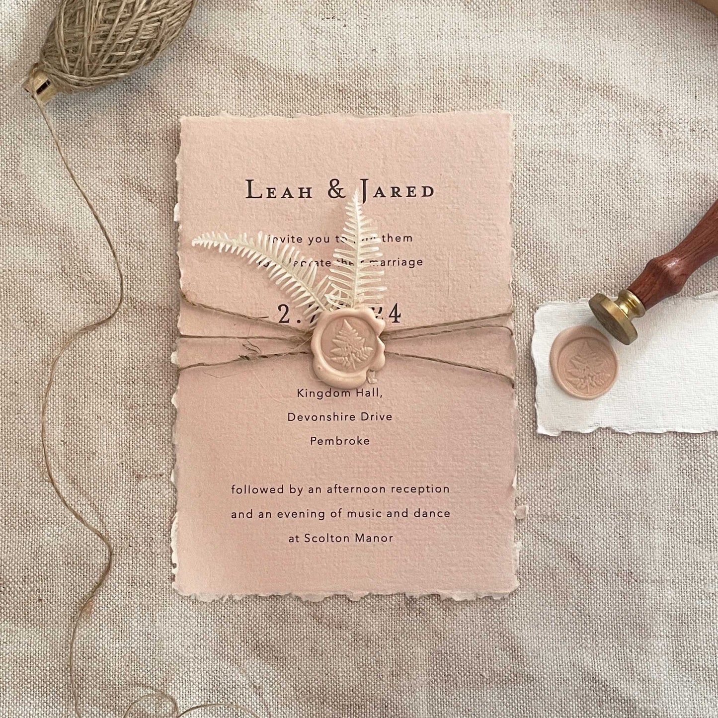 Blush pink invitation made using handmade paper; an eco friendly wax seal and jute string.  Easy eco friendly invitation to make yourself.  By The Natural Paper Company