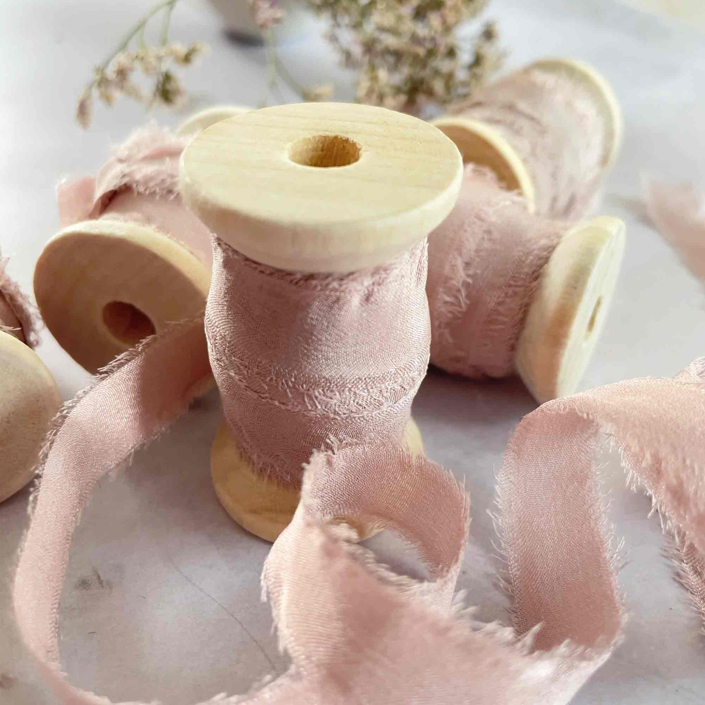 Blush Pink Fine Silk Ribbon on a wooden reel.  By The Natural Paper Company