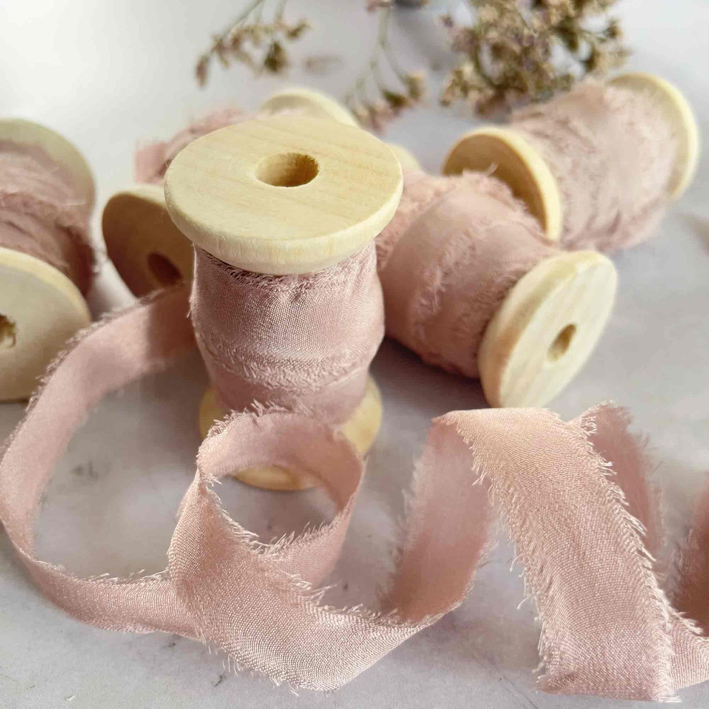 10mm narrow silk ribbon in blush pink.  Fine silk ribbon on a wooden reel
