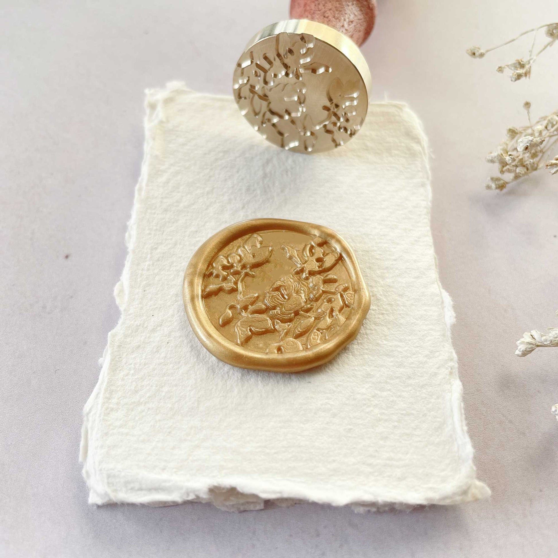 Botanica Wax Stamp.  A pretty wax seal with a botanical floral design.  Perfect for decorating wedding invitations and stationery.  By The Natural Paper Company