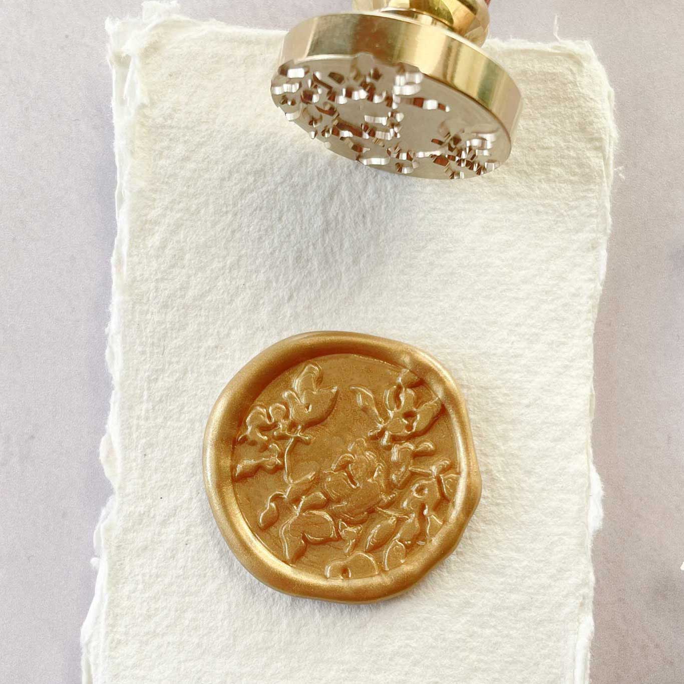 Botanica Wax Stamp with a floral pattern.  Pretty floral wax seal to decorate invitations and stationery.  By The Natural Paper Company