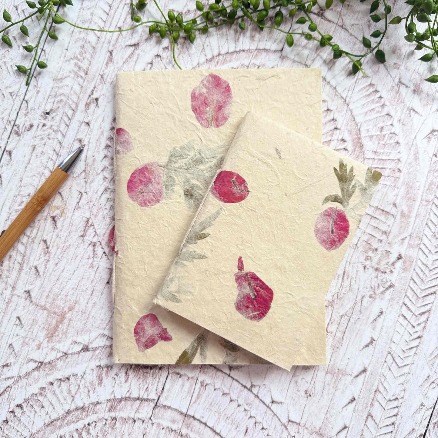 Two Lokta paper notebooks in A5 and A6 sizes, featuring real Mugwort leaves and Bougainvillea petals, handmade in Nepal