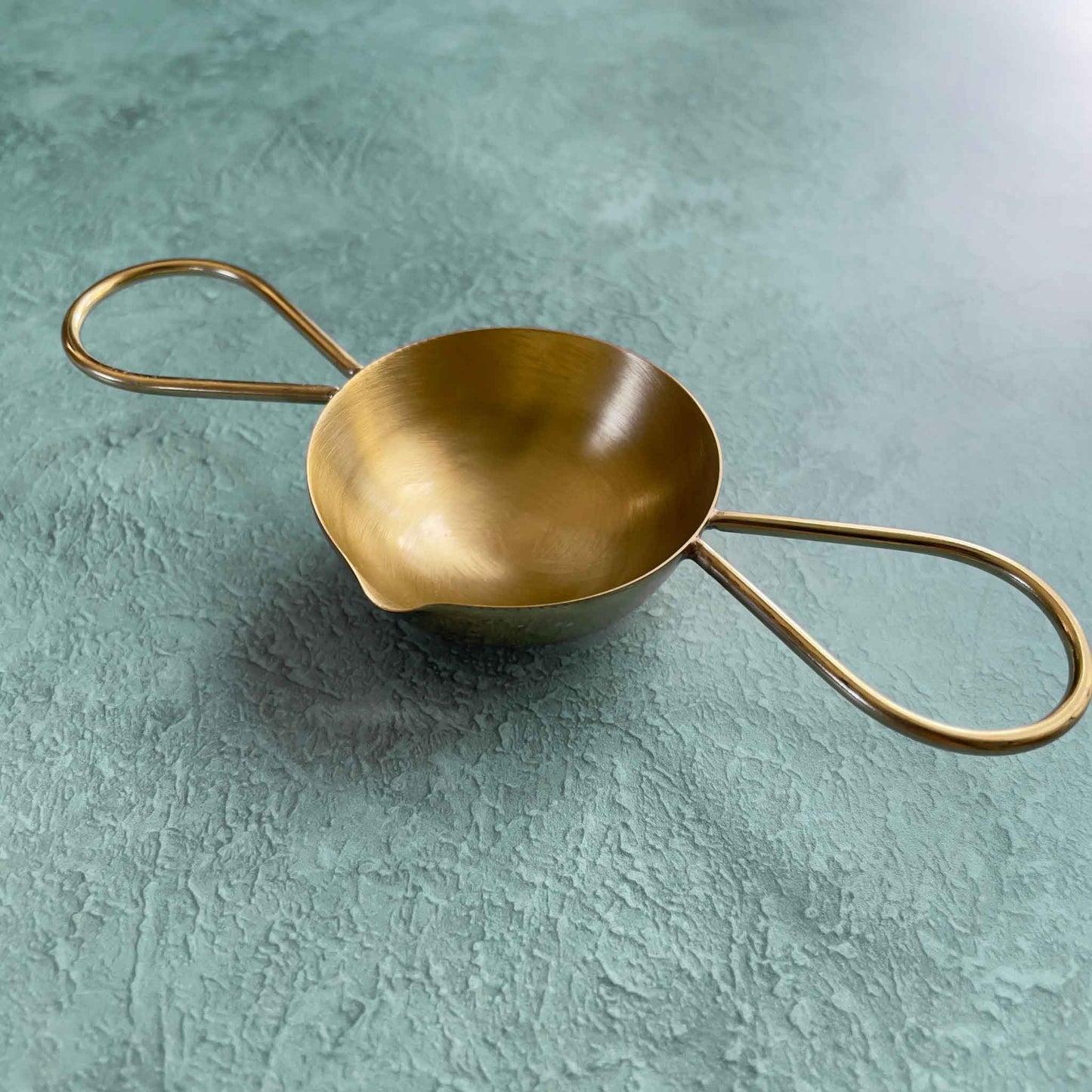 solid brass melting spoon for making wax seals with a candle and sealing wax