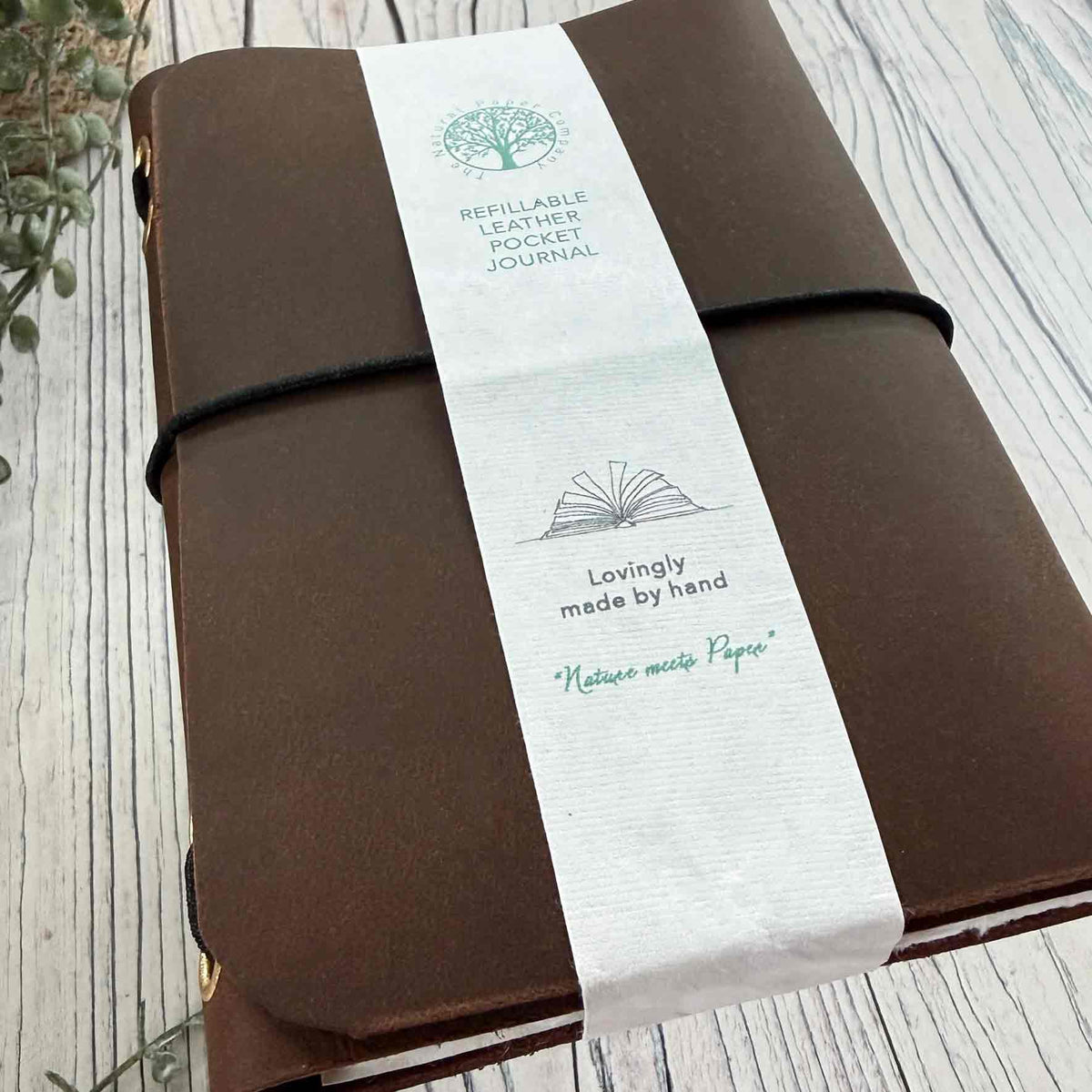 Handmade brown A6 refillable leather journal with black elastic closure
