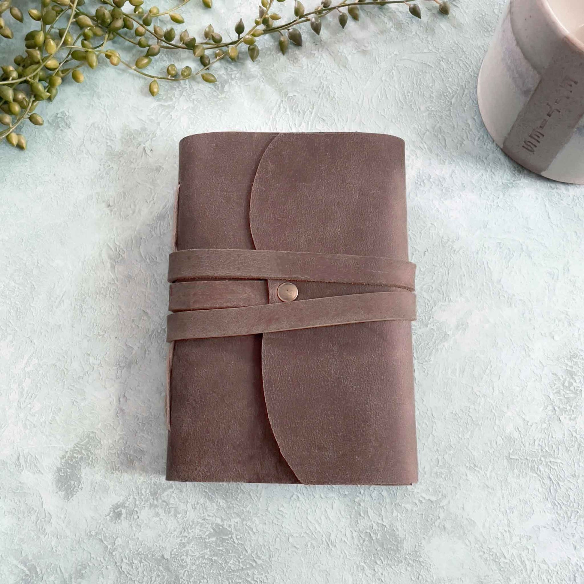 small brown leather notebook made by hand