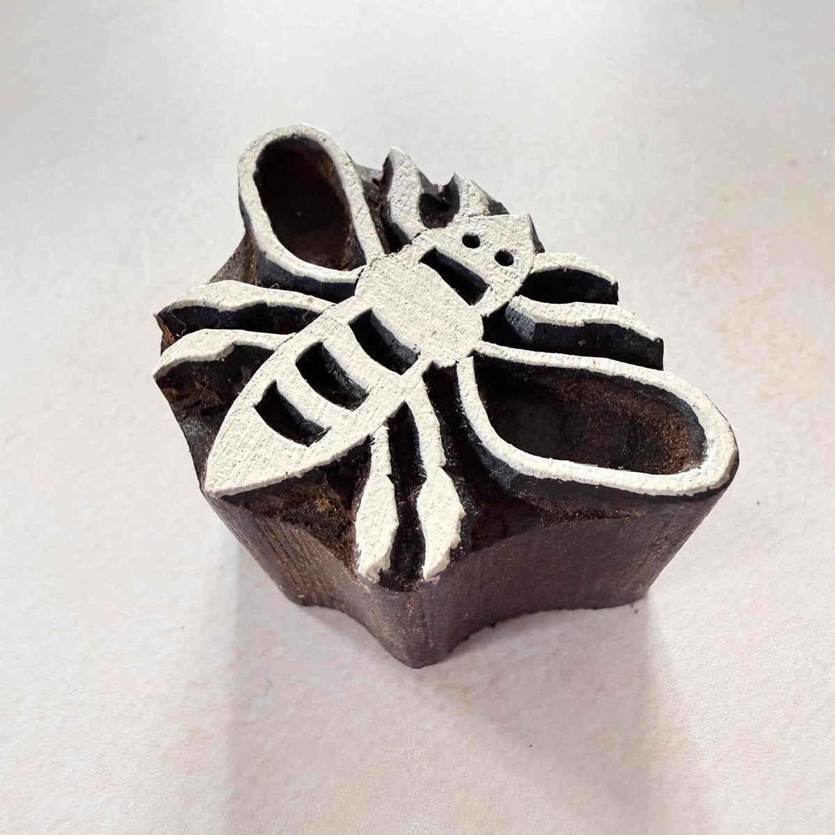 Bumble bee handmade wooden stamp with carved wings, striped body and antennae