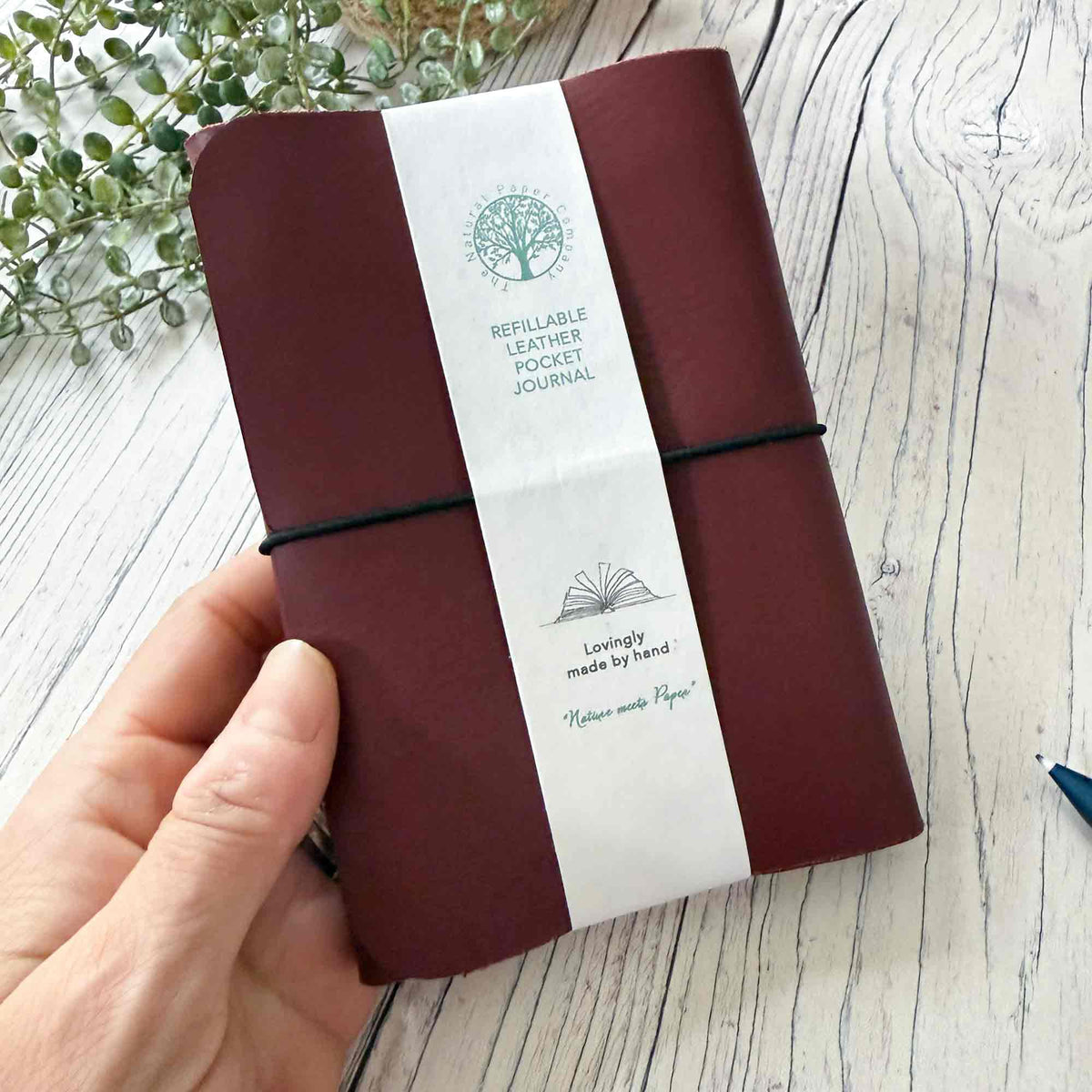 Burgundy handmade refillable leather notebook with Natural Paper Company presentation band