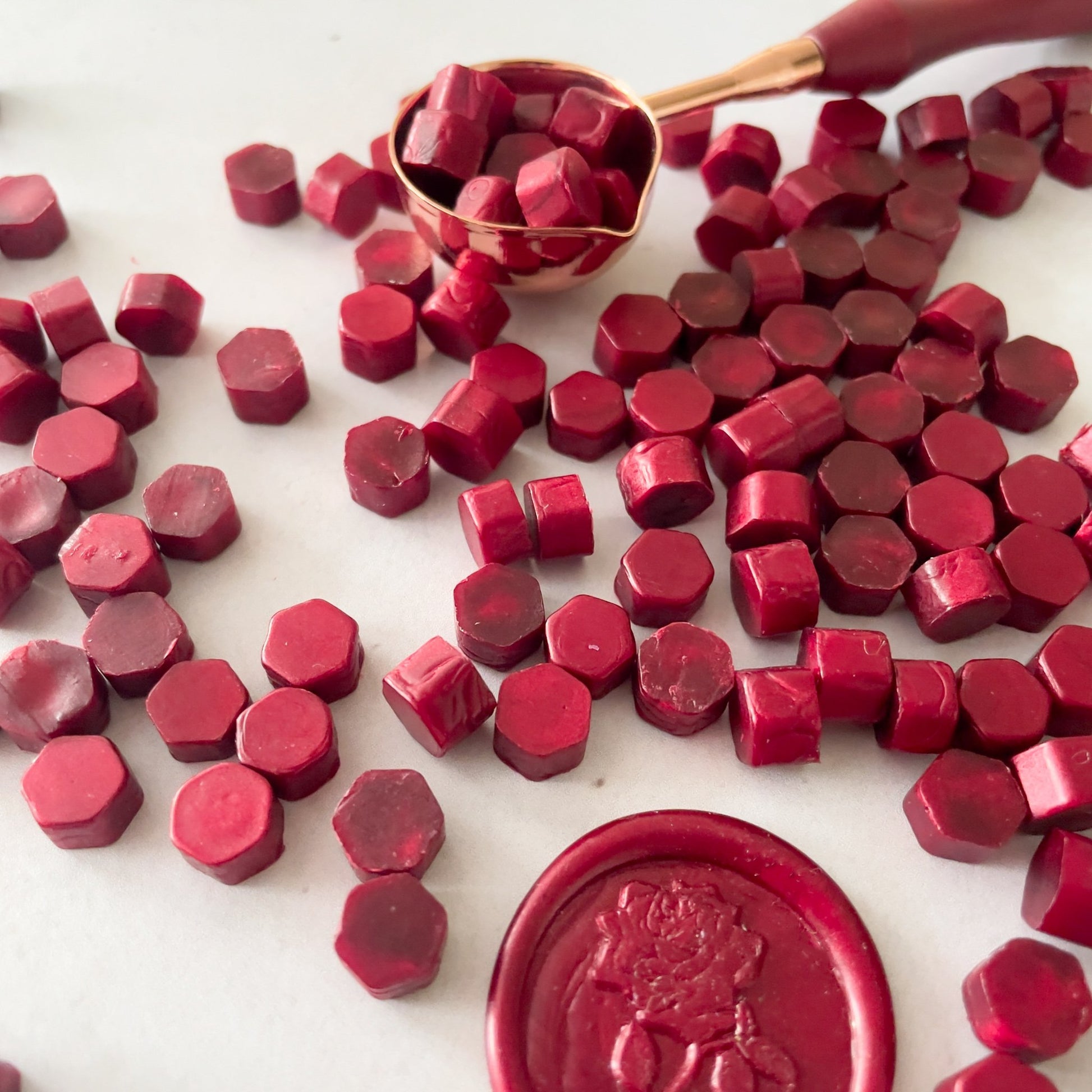 Burgundy sealing wax beads.  Make eco friendly wax seals with our plastic free wax.  by The Natural Paper Company