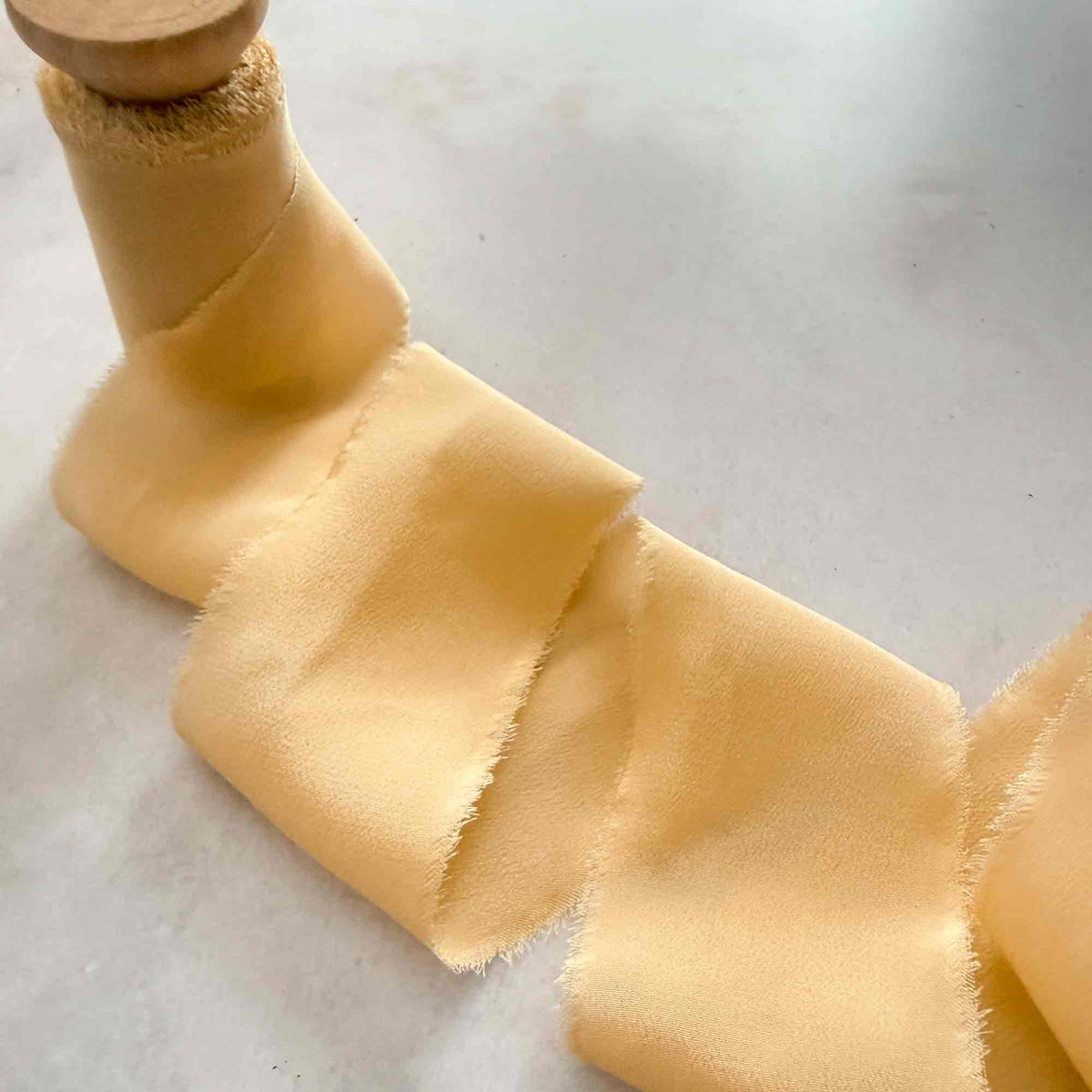 Buttermilk Habotai silk ribbon in 25mm and 50mm widths