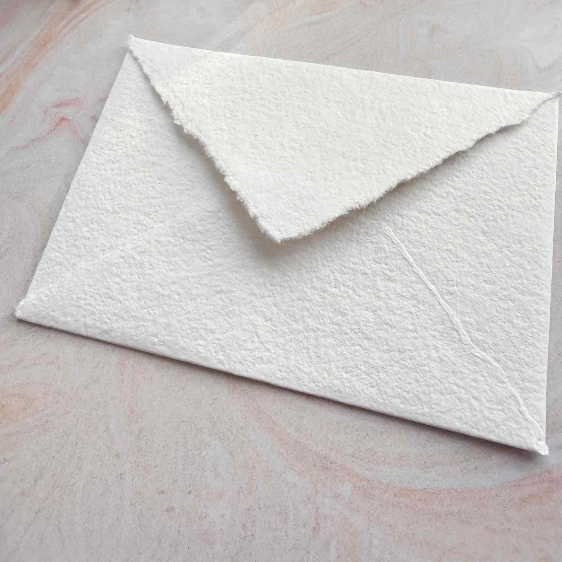 handmade cotton paper envelopes with deckled edges and pointed flap