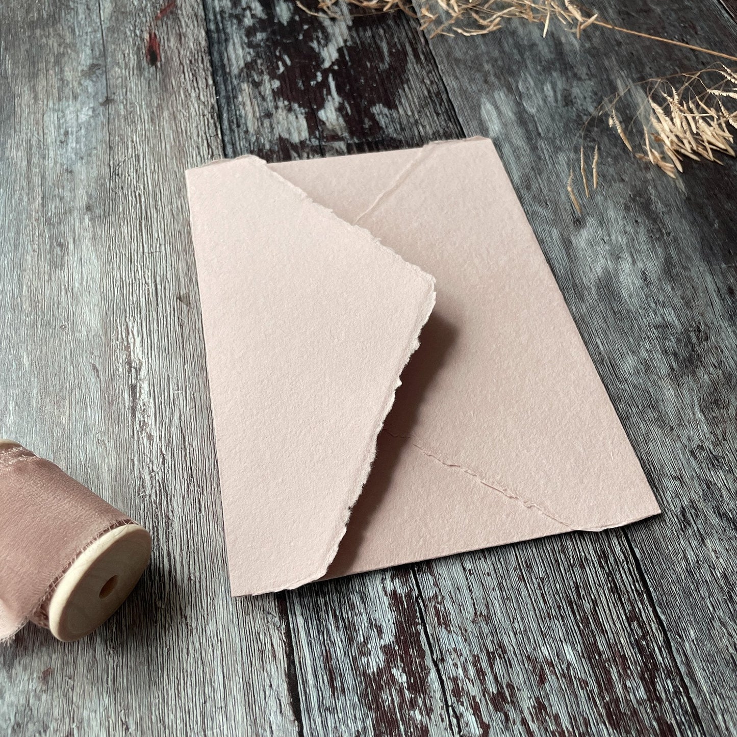 Handmade paper envelopes in blush pink.  Made from Recycled cotton rag fibres, these deckled edge envelopes are perfect for invitations.  By The Natural Paper Company