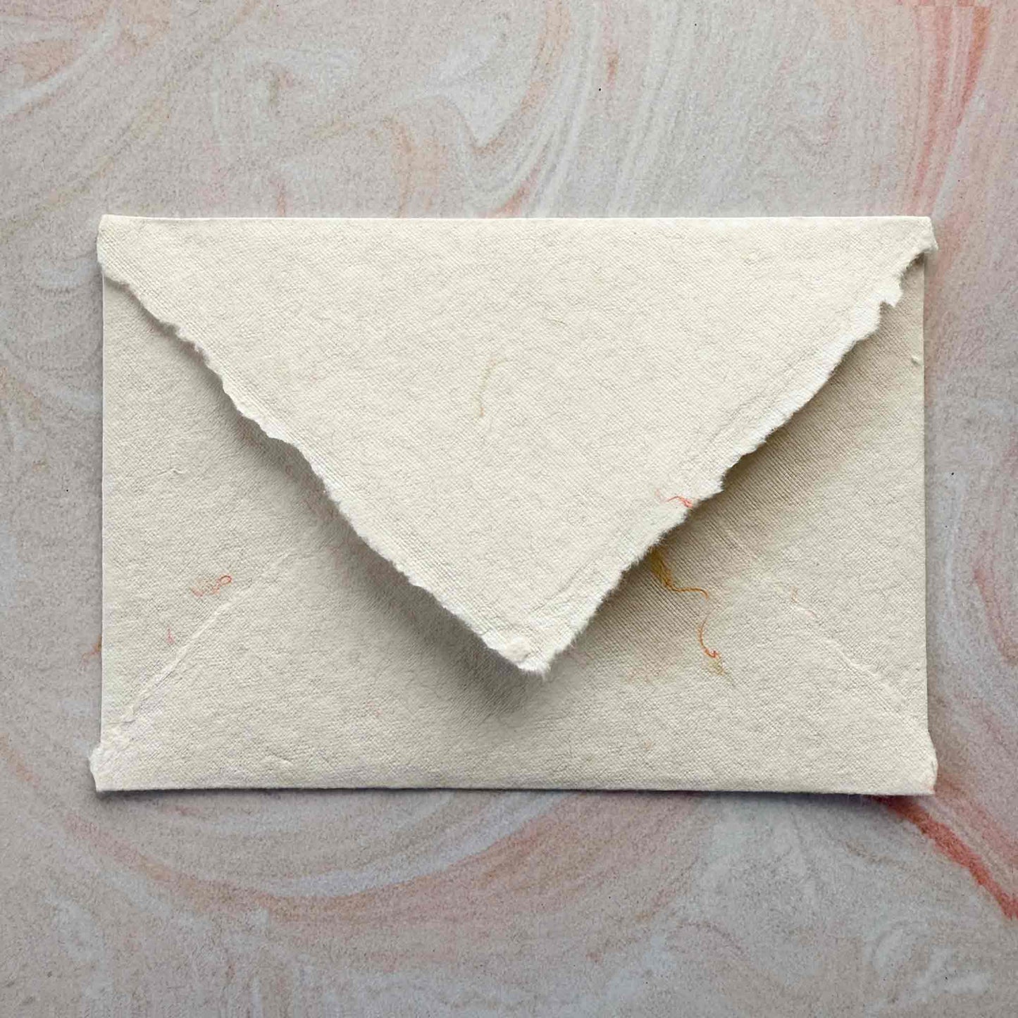 deckled edge handmade cotton paper envelope with added wool fibres