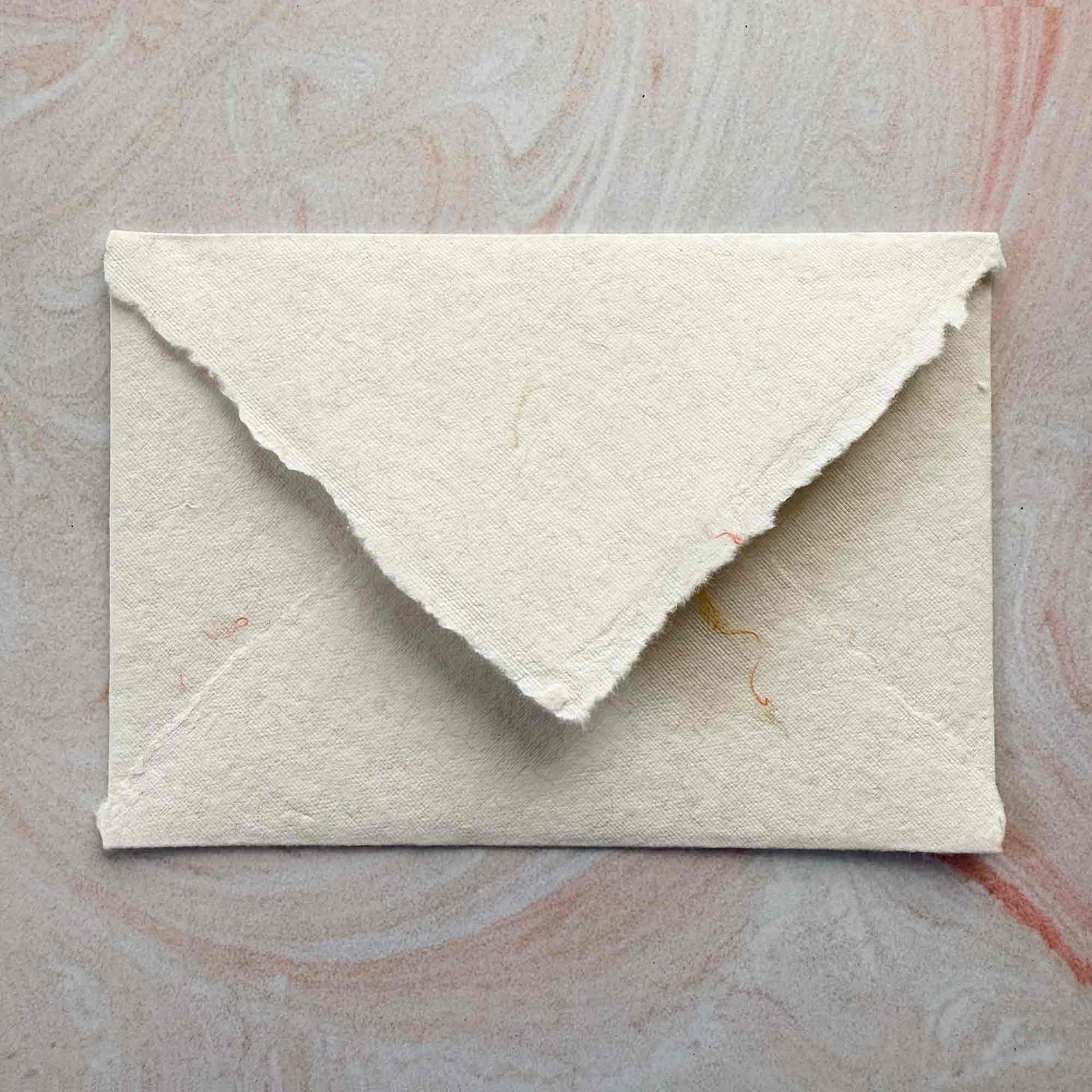 deckled edge handmade cotton paper envelope with added wool fibres
