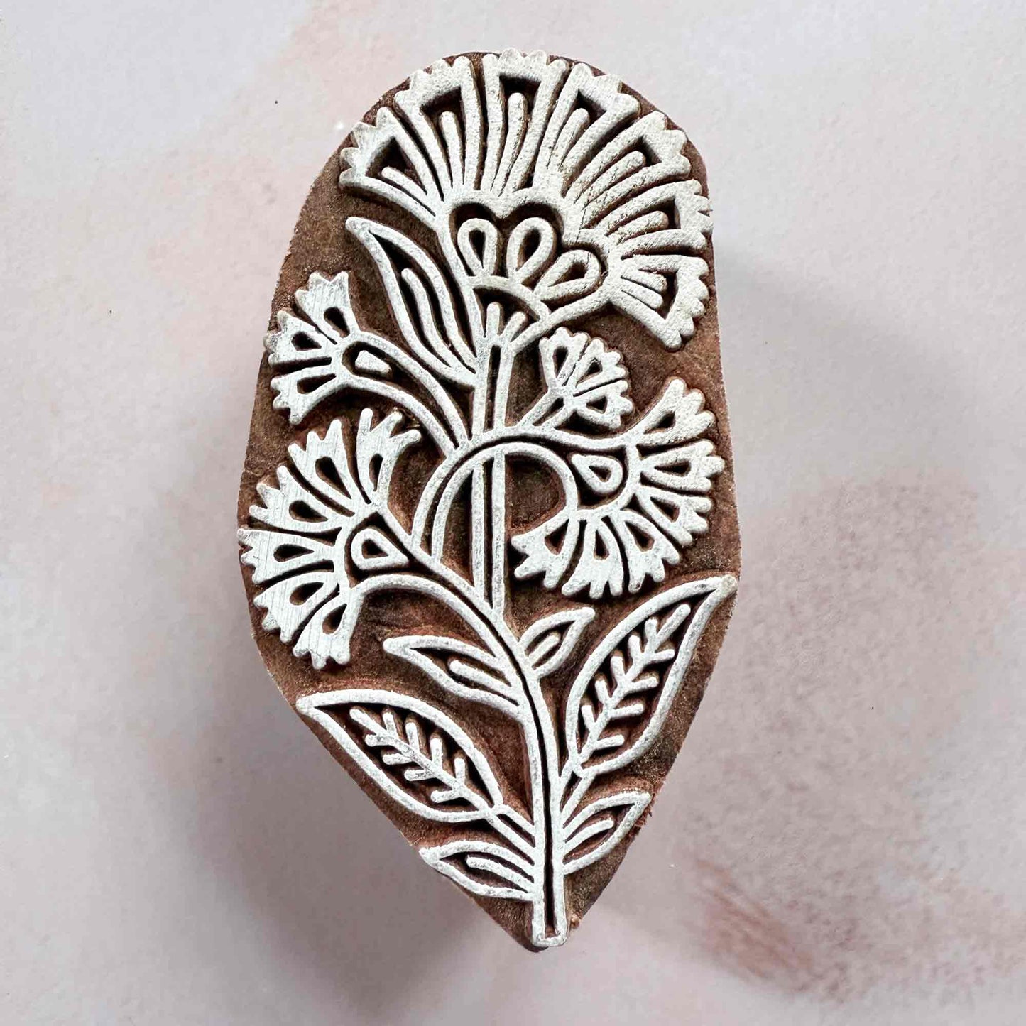 floral wood block stamp with detailed carnation pattern