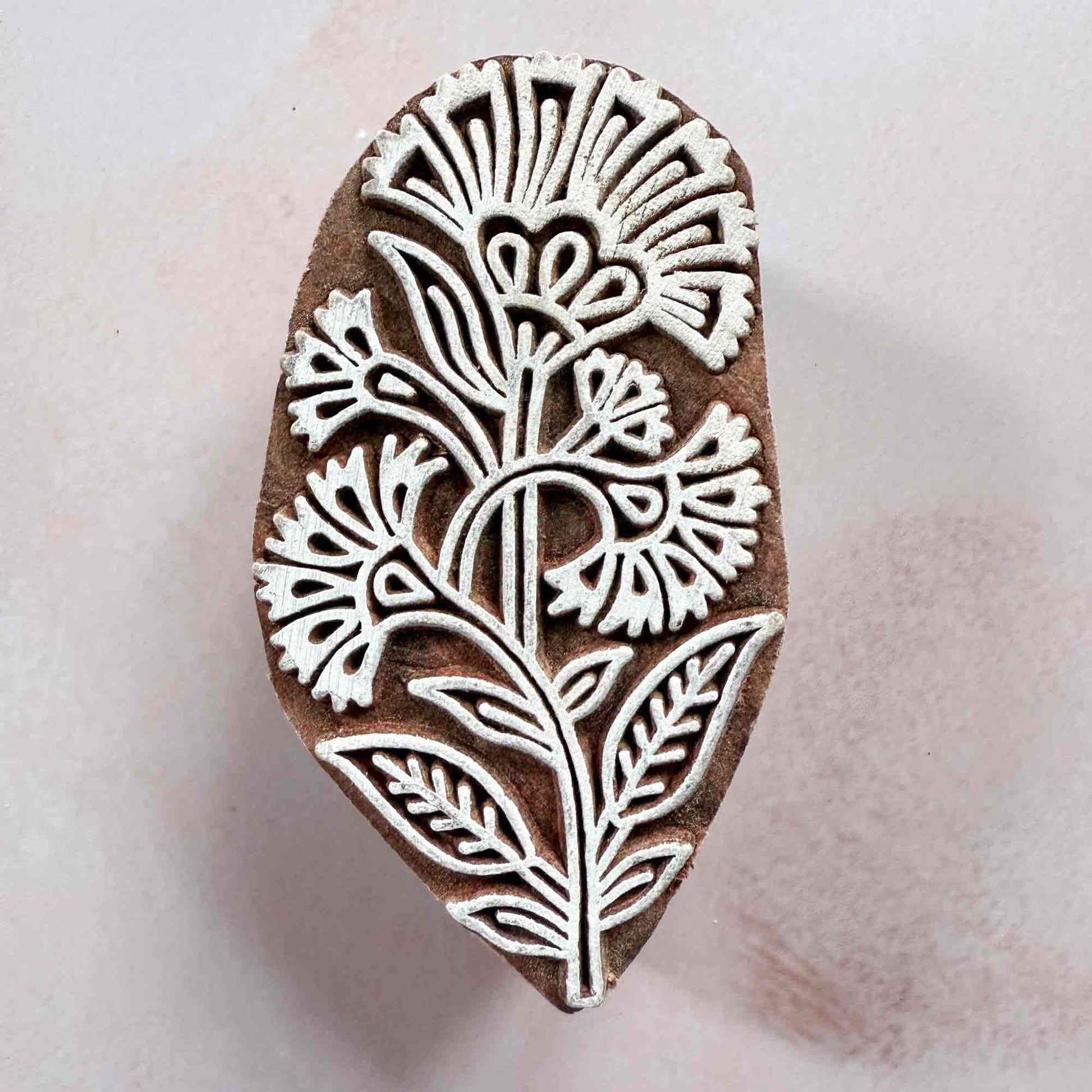 floral wood block stamp with detailed carnation pattern