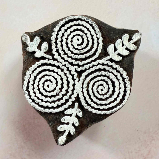 wooden stamp with stylised flower pattern