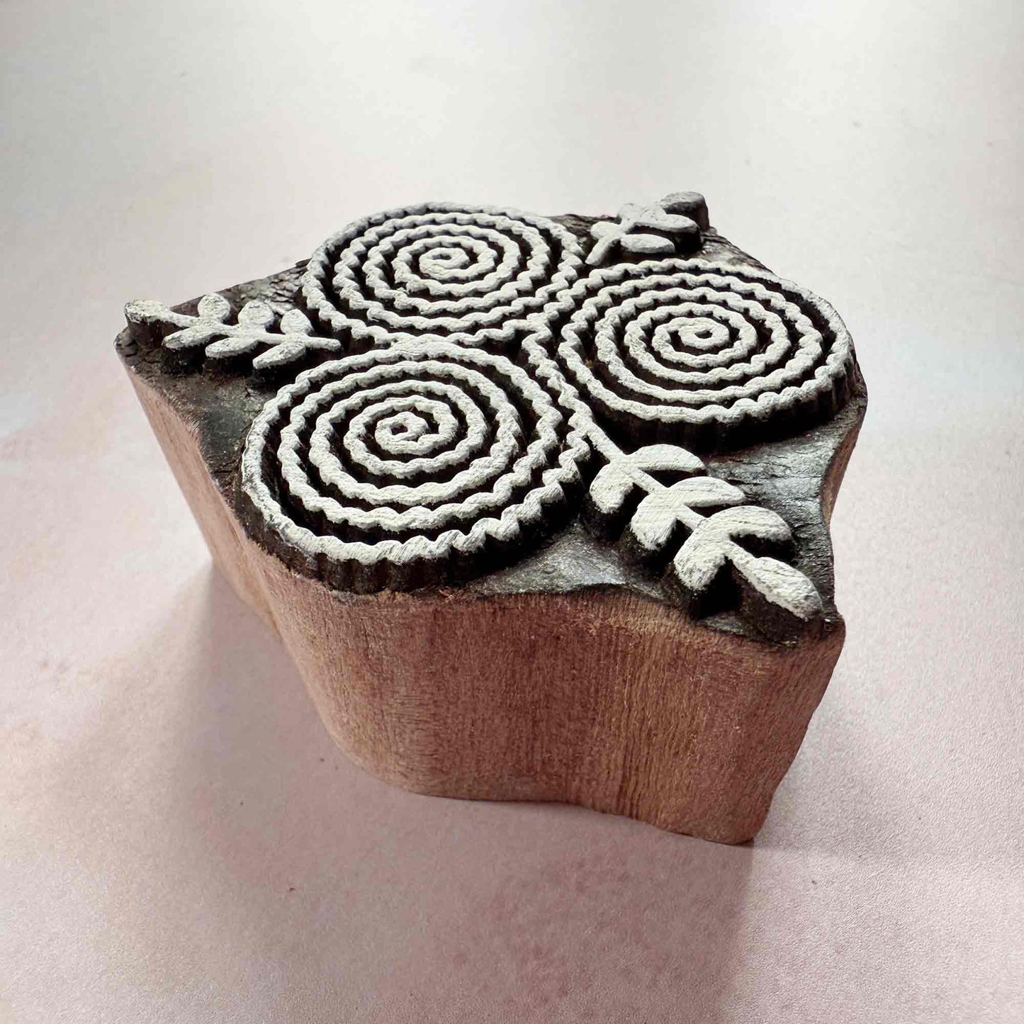 Wooden stamp with a floral design
