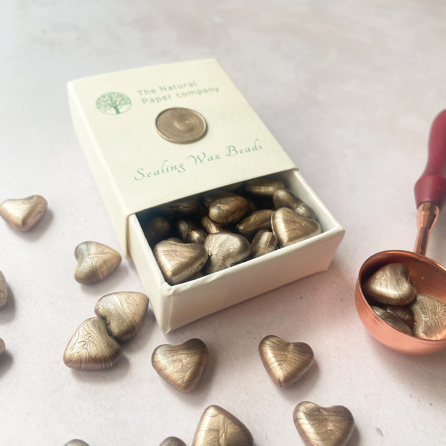 Champagne Gold Sealing Wax Beads in a Box.  Small box of eco friendly wax to make wax seals.  Plastic free, Paraffin free and biodegradable wax in a champagne gold colour.  By The Natural paper Company