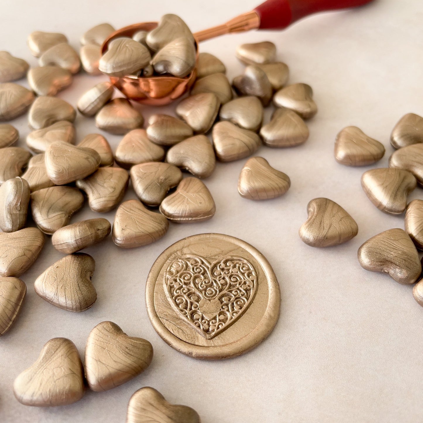 Use these champagne gold sealing wax beads to make eco friendly wax seals with a melting spoon.  by The Natural Paper Company