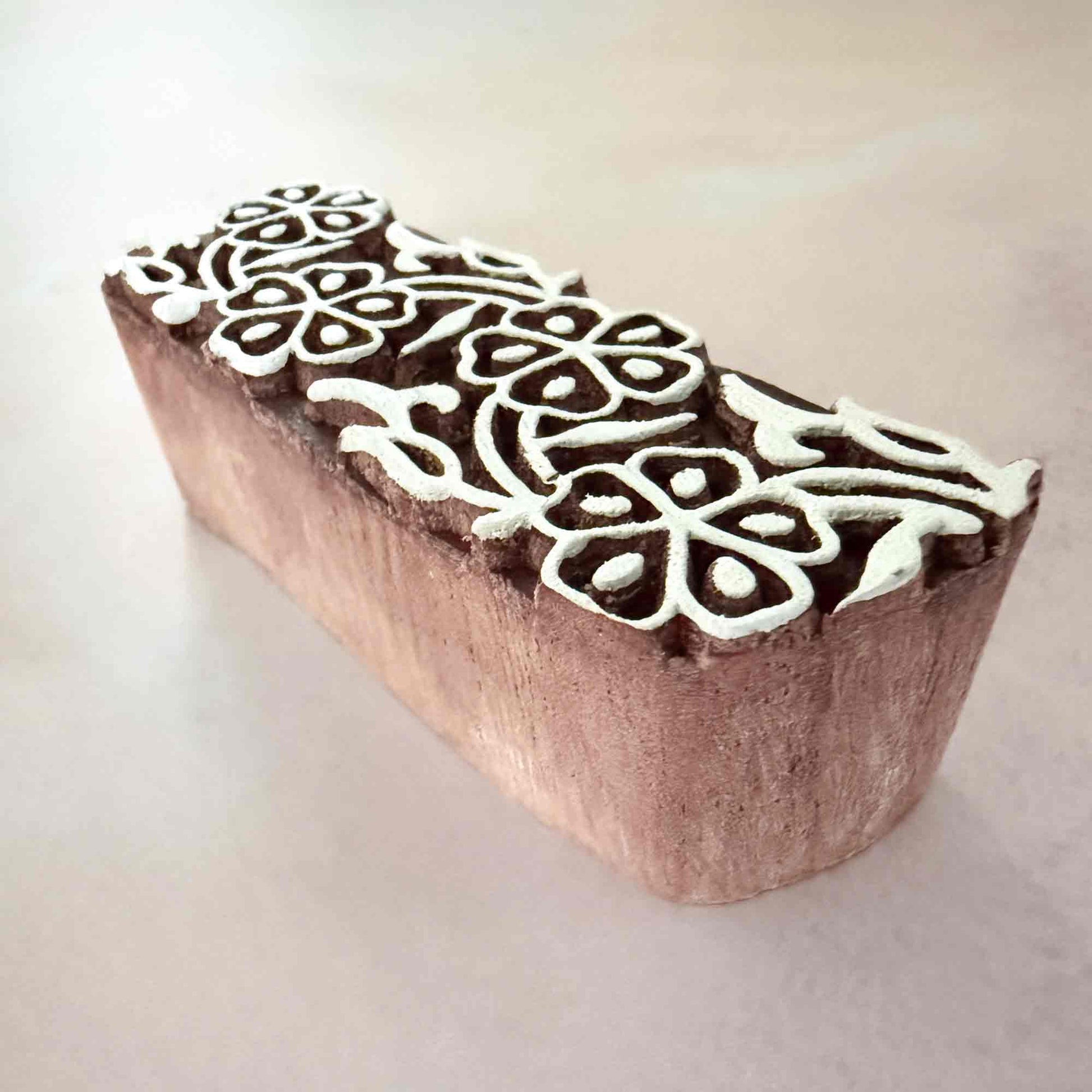Wooden block with white floral design for printing onto card and fabric