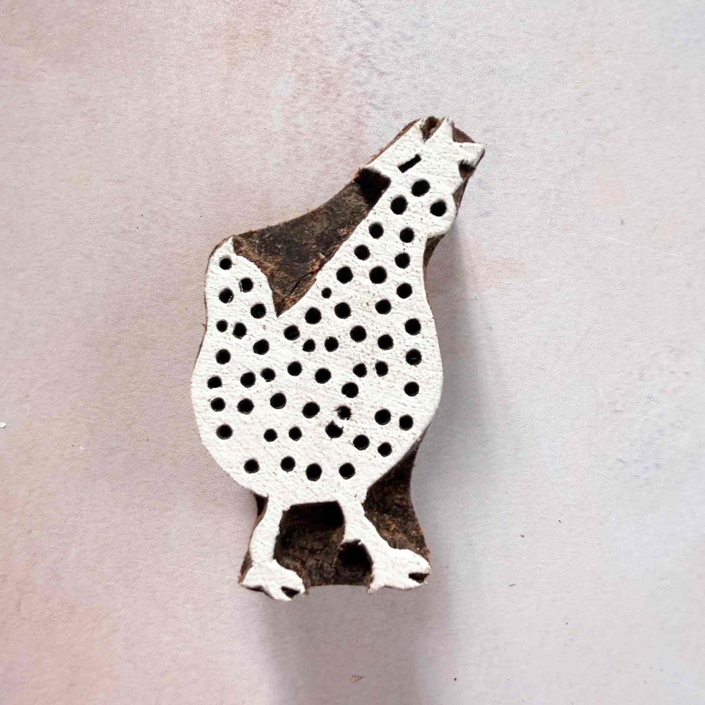 Indian wood block stamp — Cluck Chicken face-on view on soft pale background, plump dotted body with sweet outline, hand-carved wooden stamp, authentic traditional printing block from India
