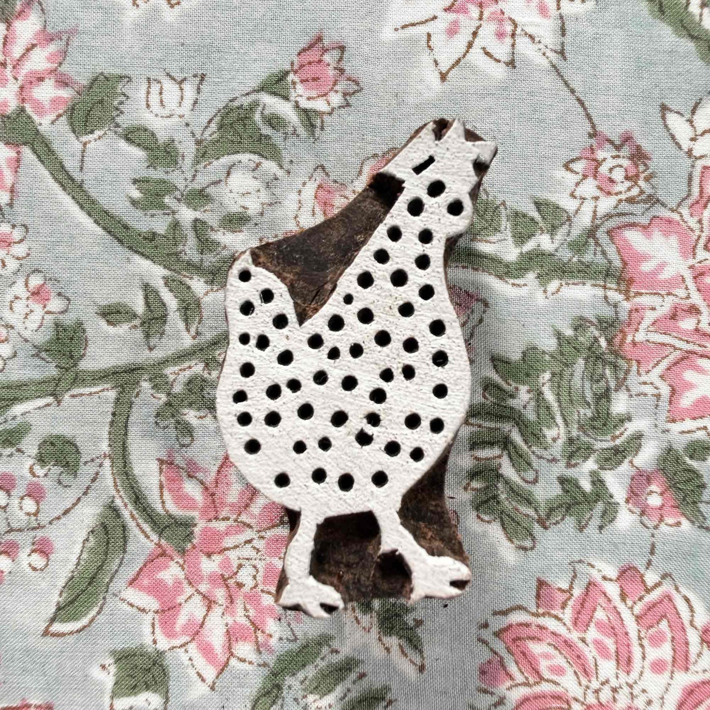 Indian wood block stamp — Cluck spotted hen resting on block printed fabric, charming dotted hen design ready for printing, hand-carved wooden stamp, classic traditional printing block farmhouse motif