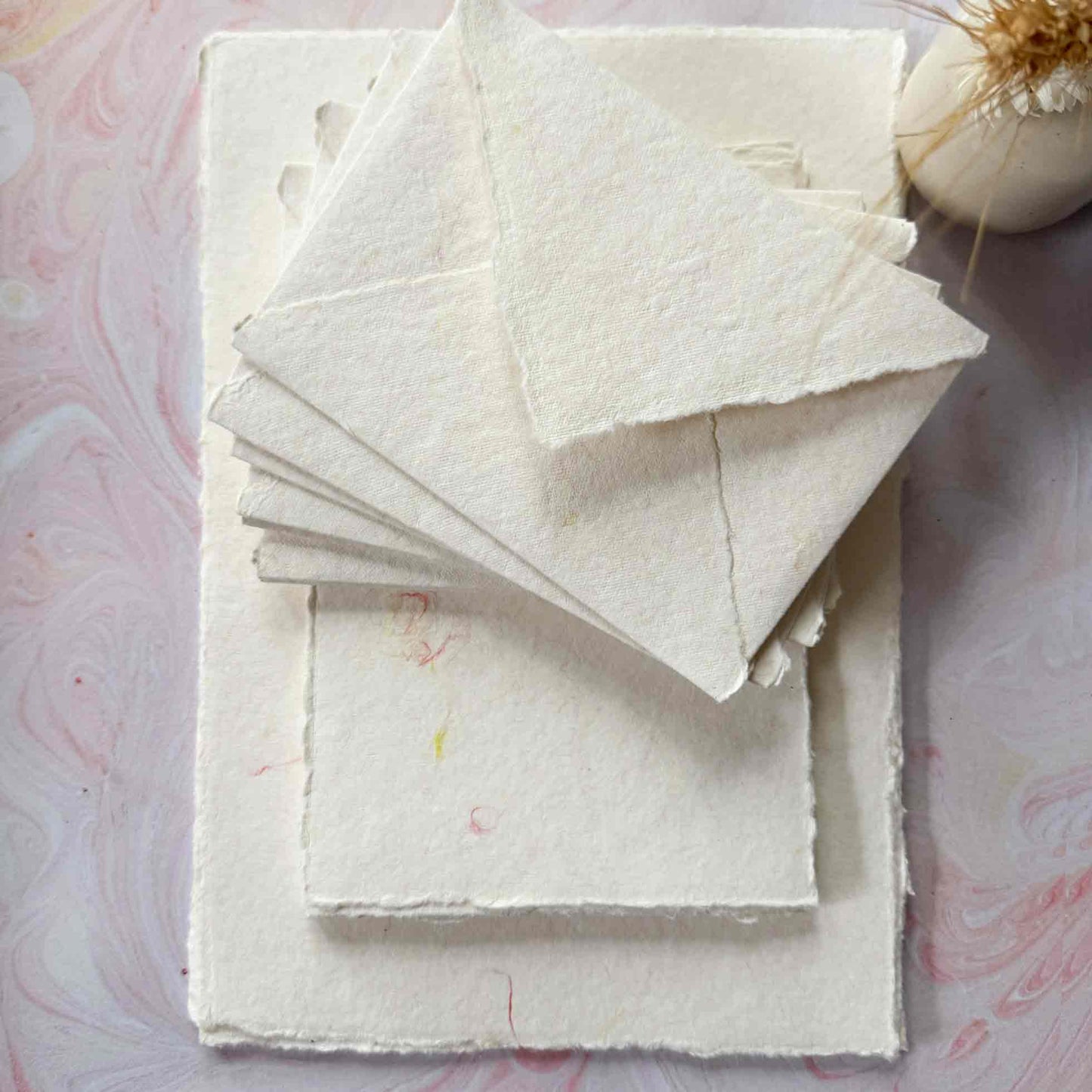 decorative handmade paper with deckled edges and wool fibres