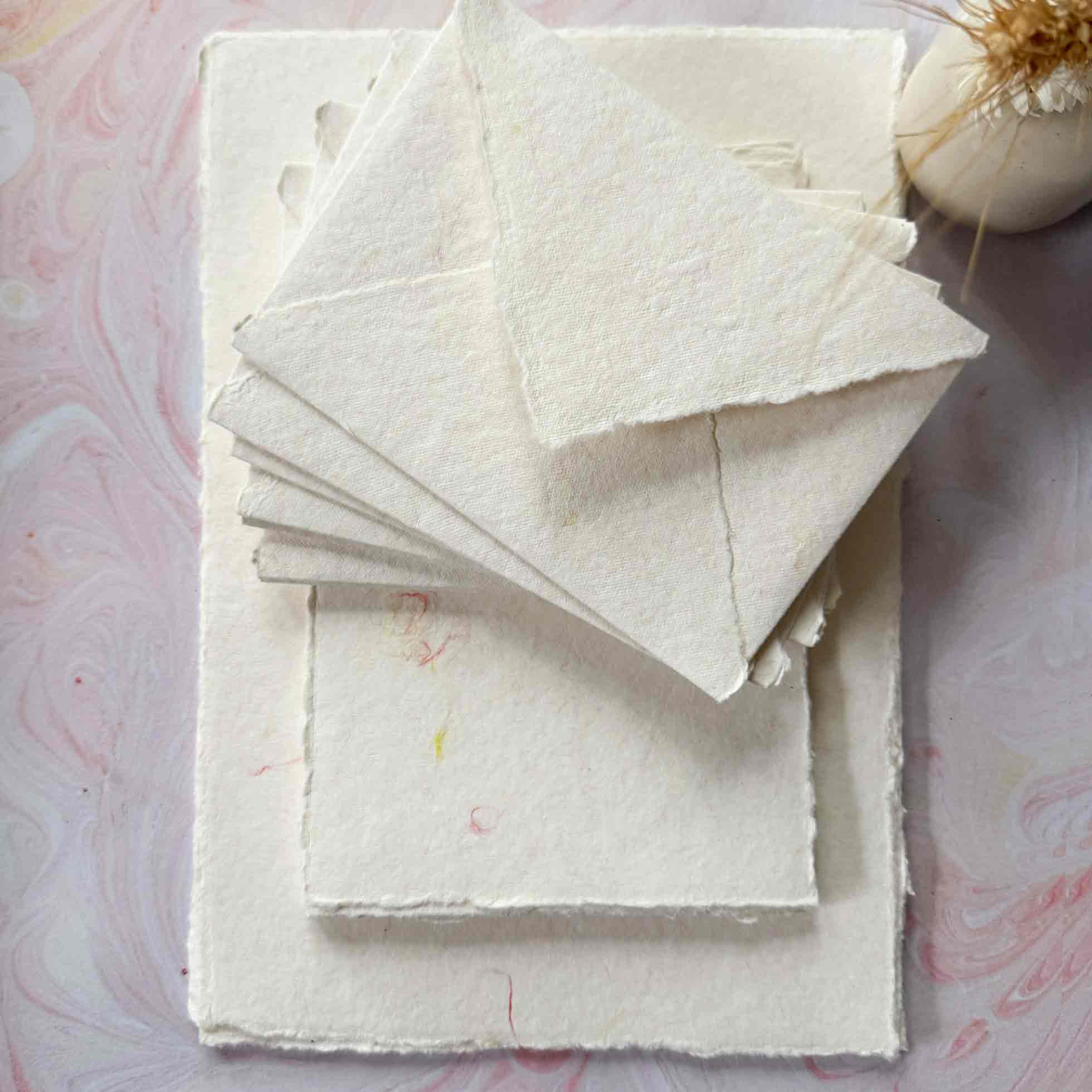 decorative handmade paper with deckled edges and wool fibres