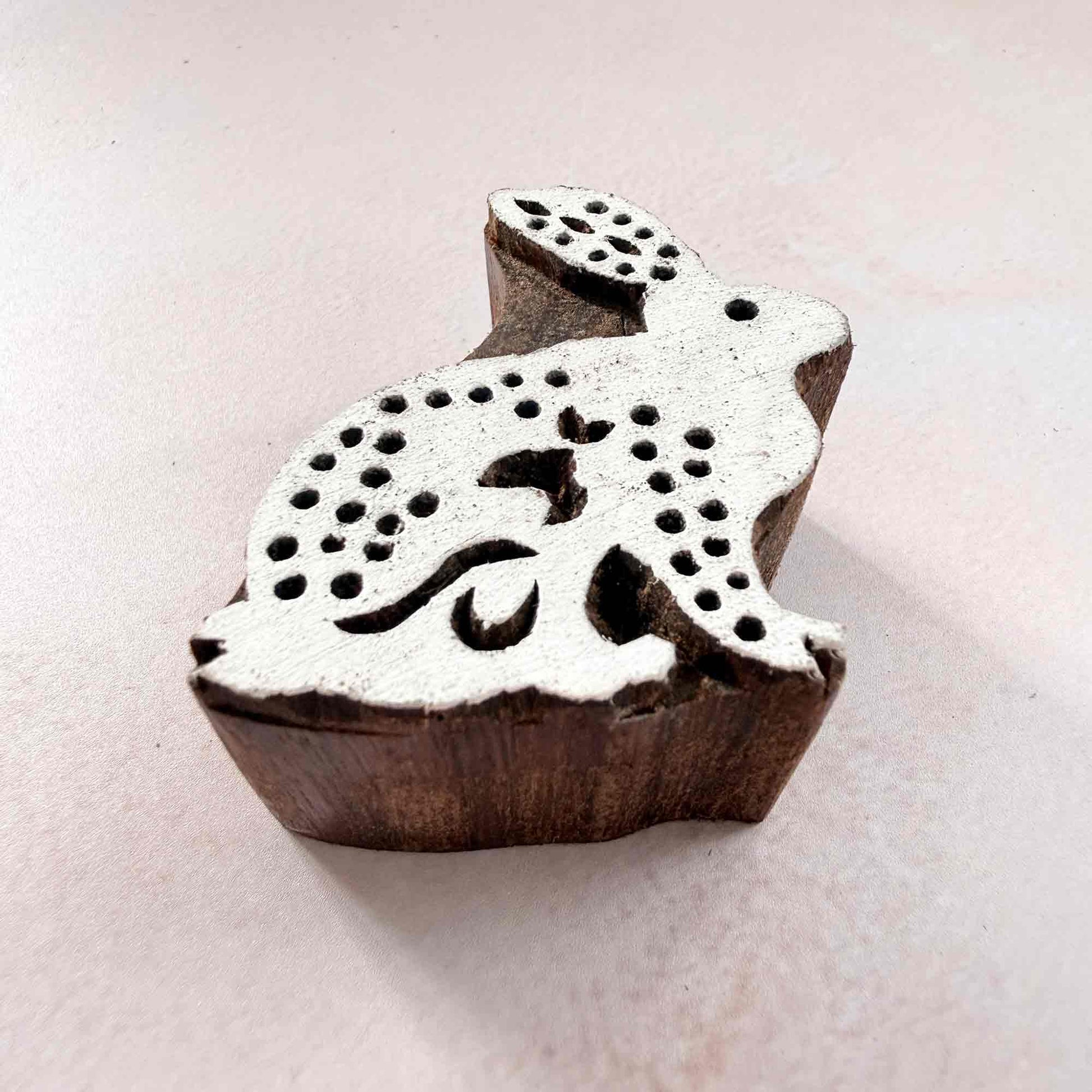 Indian wood block stamp — Cottontail spotted rabbit viewed from angle, showing carved depth and delicate spot texture, handcrafted wooden stamp, premium traditional printing block hardwood
