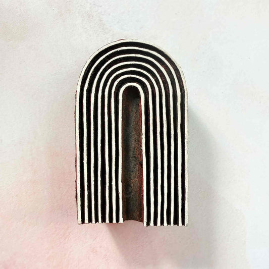 Cove Indian wood block stamp — modern curved arch design on pale background