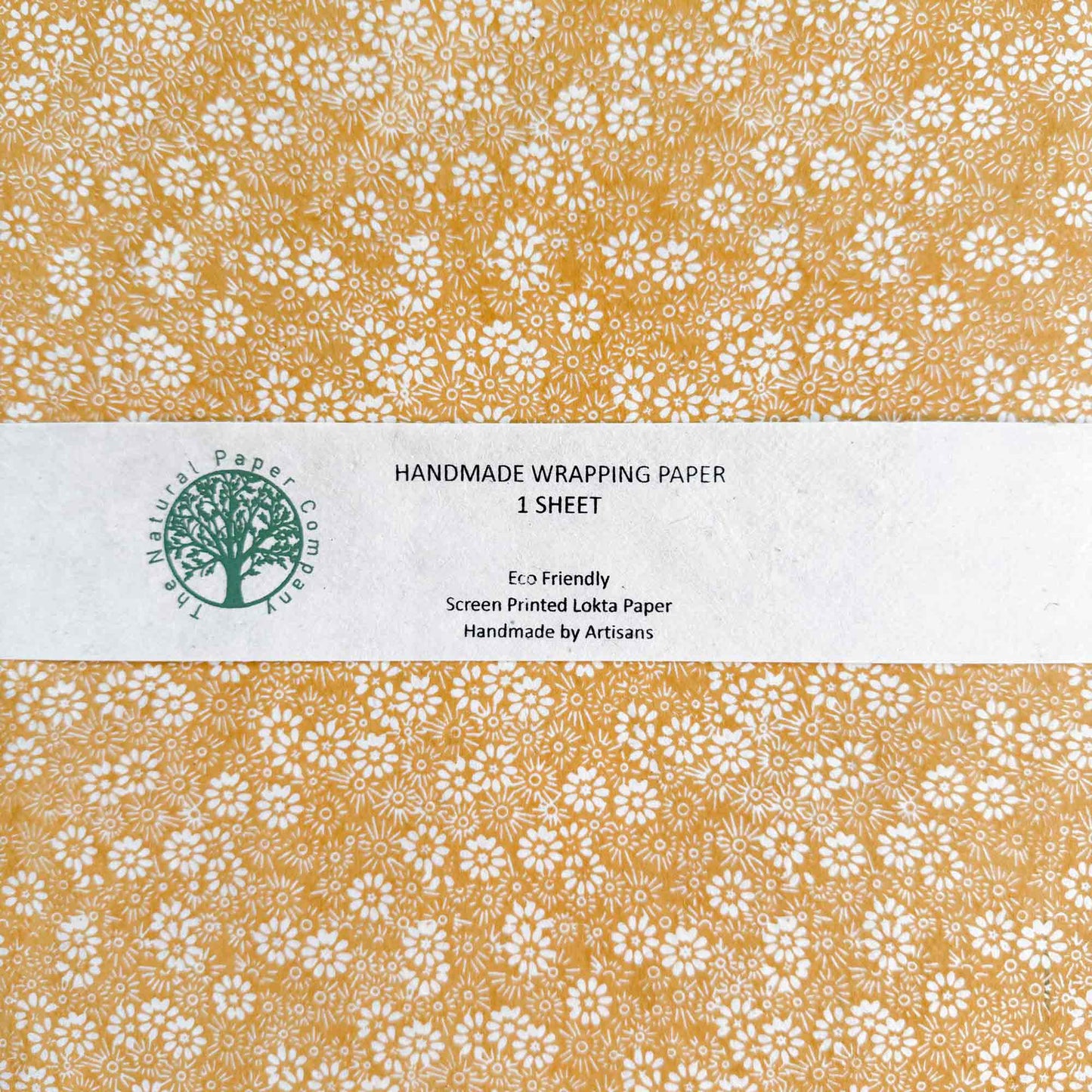 Handmade wrapping paper sheet with floral pattern and branding 