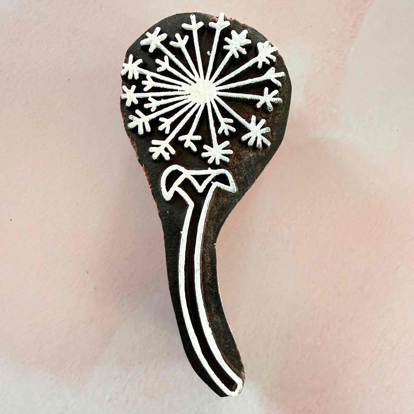 decorative wooden stamp with a dandelion clock design