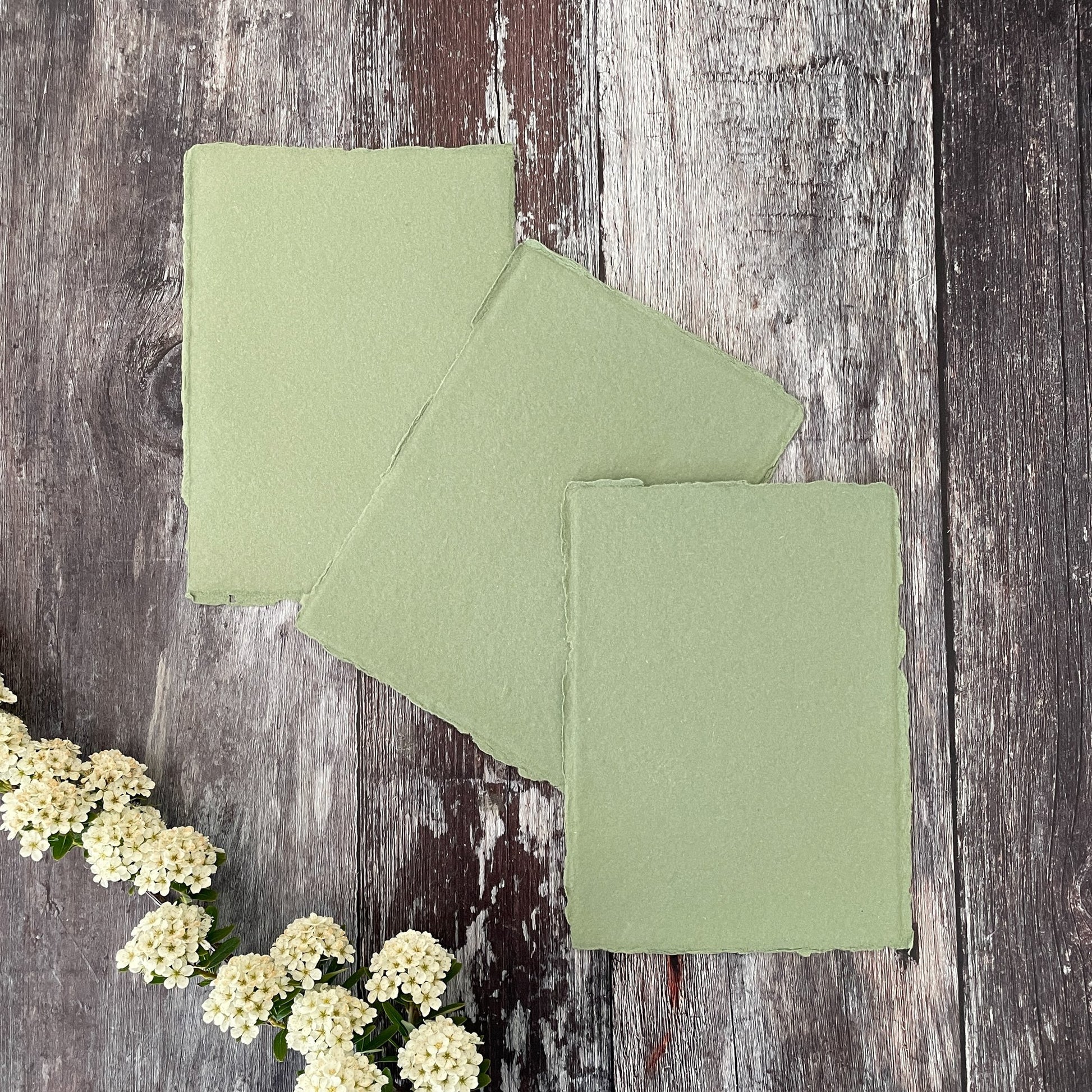 Sage green handmade paper and card made from recycled cotton rag.  Deckled edge paper in sage green.  Handmade using traditional methods.  Acid free and vegan watercolour paper.  By The Natural paper Company