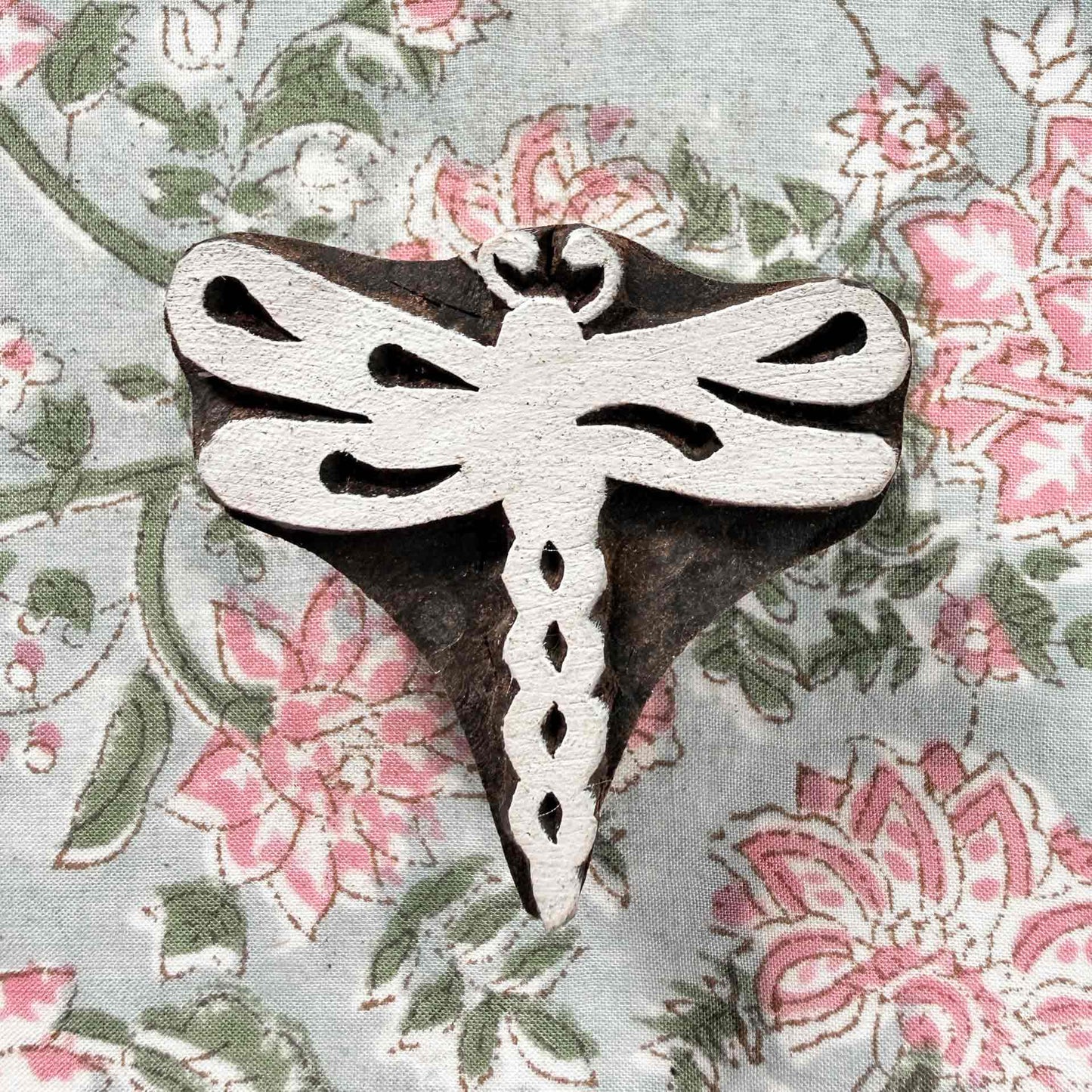 Dragonfly Indian wood block stamp displayed on block printed fabric