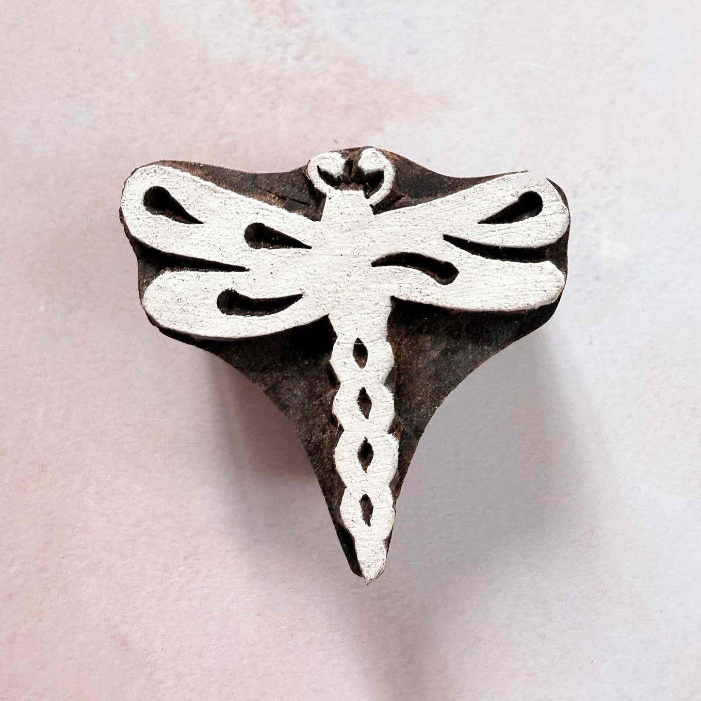 Dragonfly traditional printing block with decorative wings and patterned body