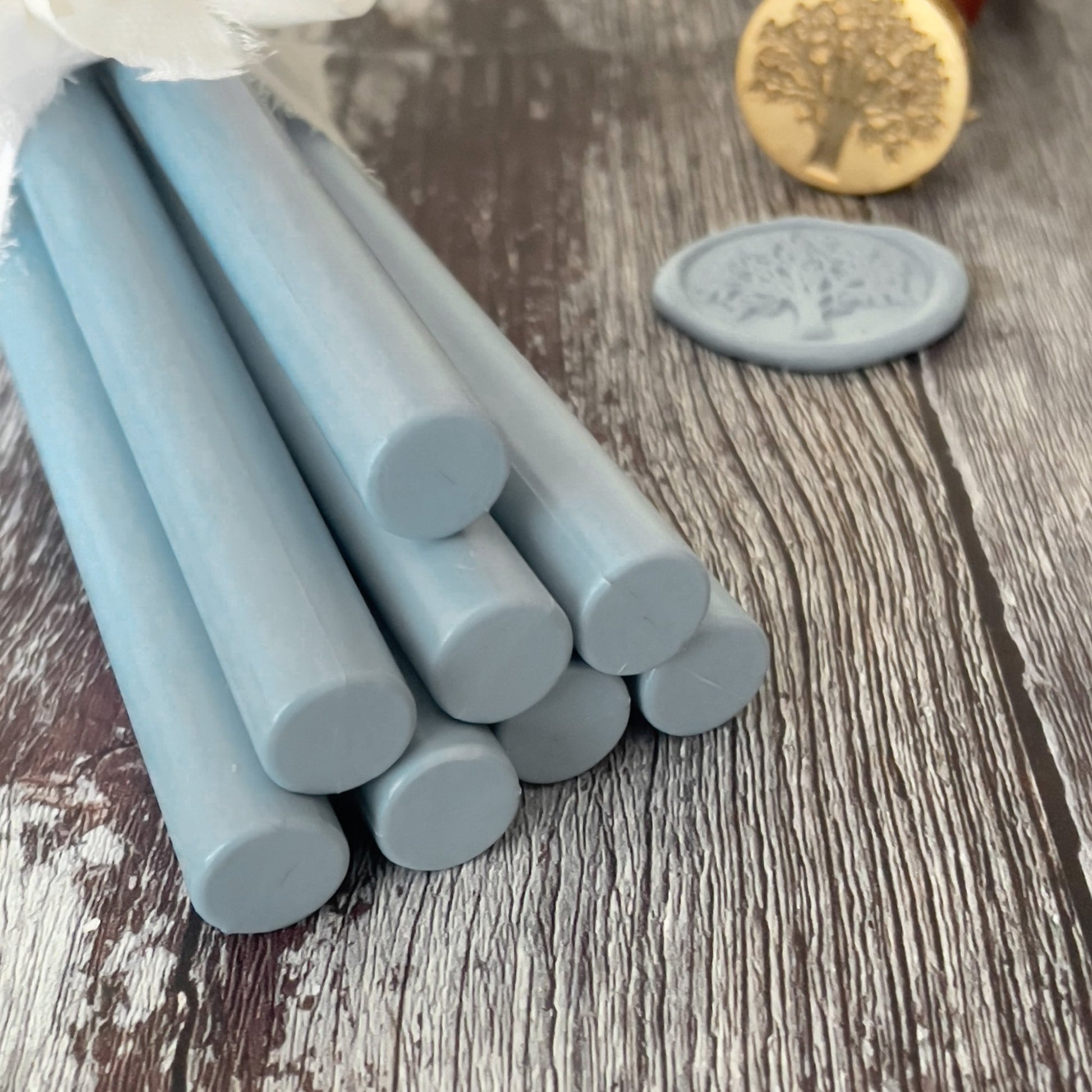 Eco friendly sealing wax sticks in dusky blue.  11mm glue gun wax seal sticks.  Plastic free, paraffin free and biodegradable wax for making wax seals.  By The Natural Paper Company