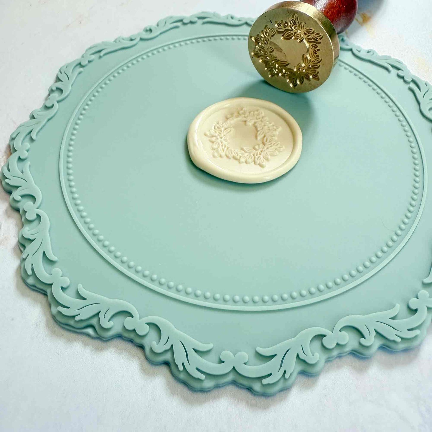 Silicon wax seal mat in dusky blue colour.  A small non stick mat for making wax seals.