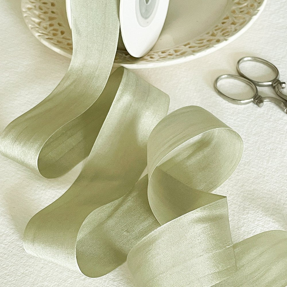 Fine silk ribbon for crafts.  Pale dusky green colour habotai silk ribbon sold by the meter.  By The Natural Paper Company