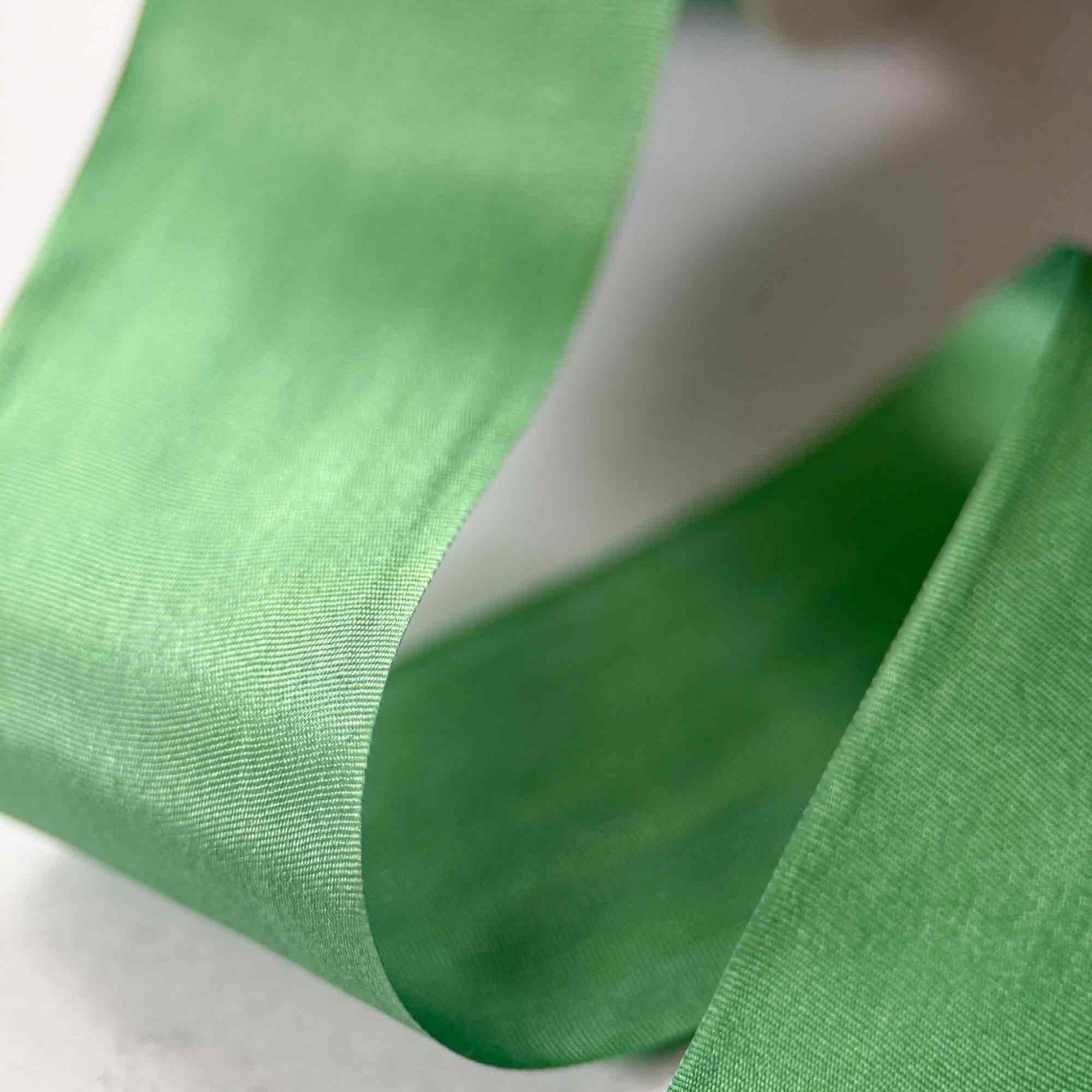 Close-up of green fabric with a blurred background