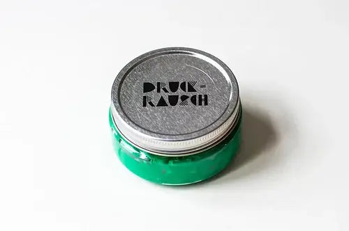 small pot of mint green water based printing ink for fabric and paper