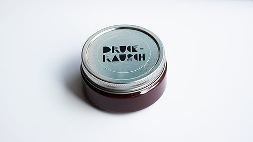 small jar of brown water based ink for printing