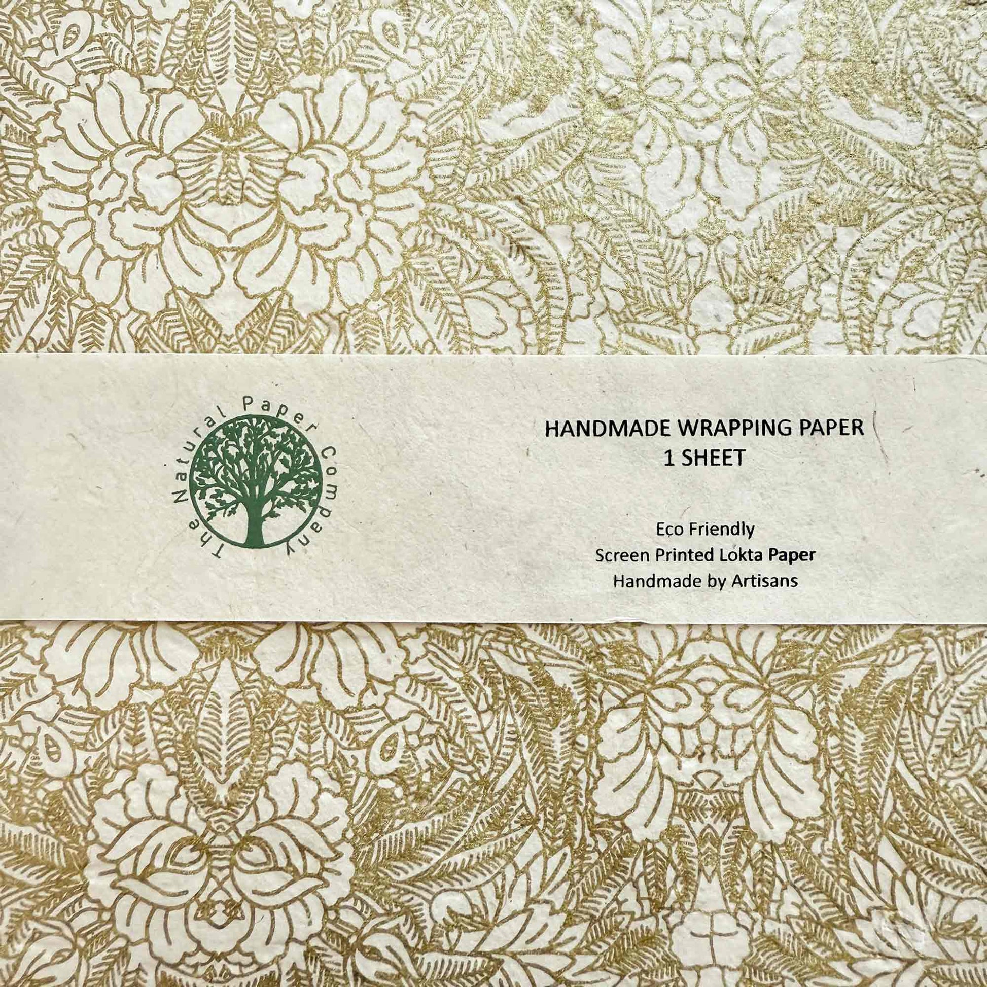 Handmade wrapping paper sheet with floral design and brand label.