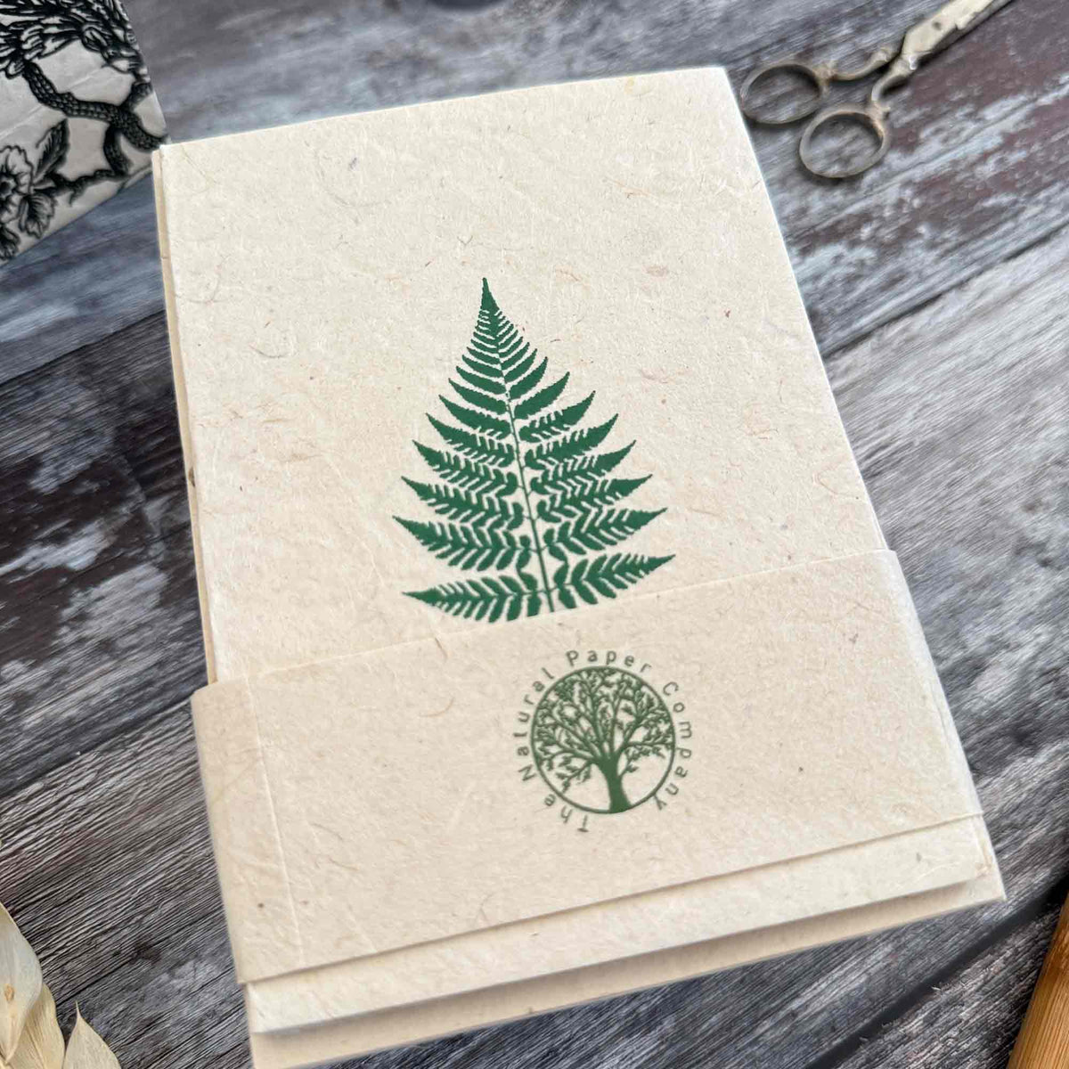 A6 Fern Lokta paper card with green botanical leaf design and matching envelope