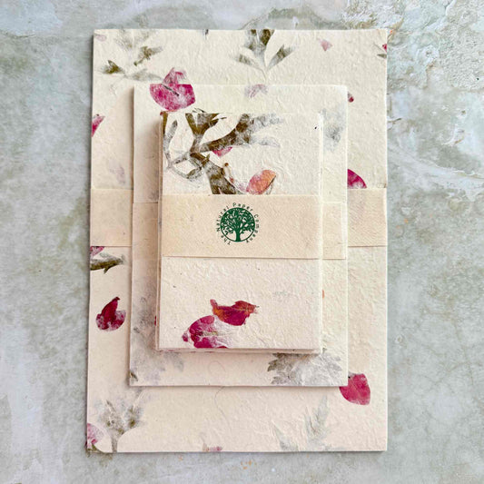 set of eco friendly lokta paper and envelopes with dried petals and leaves