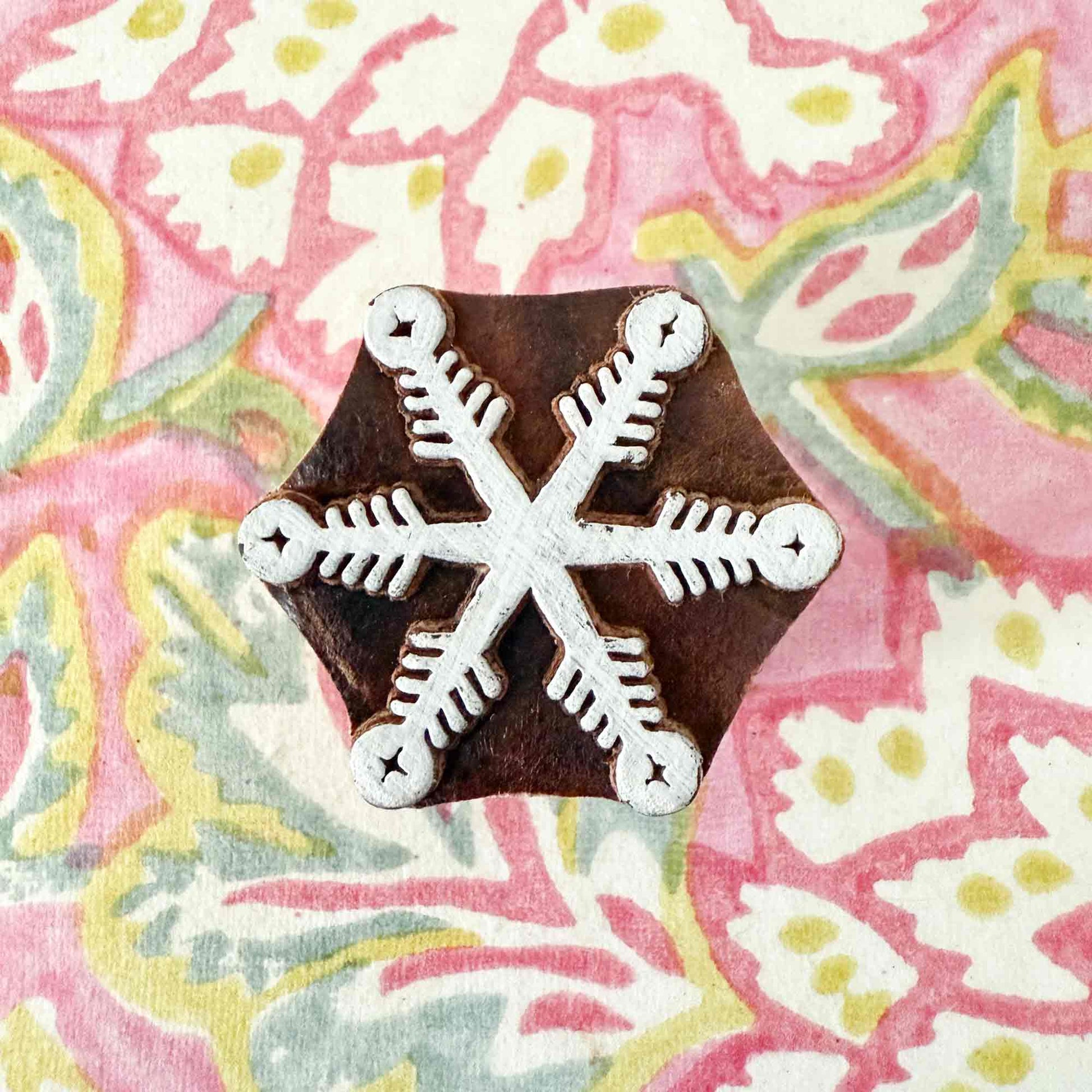 wooden stamp with snowflake pattern