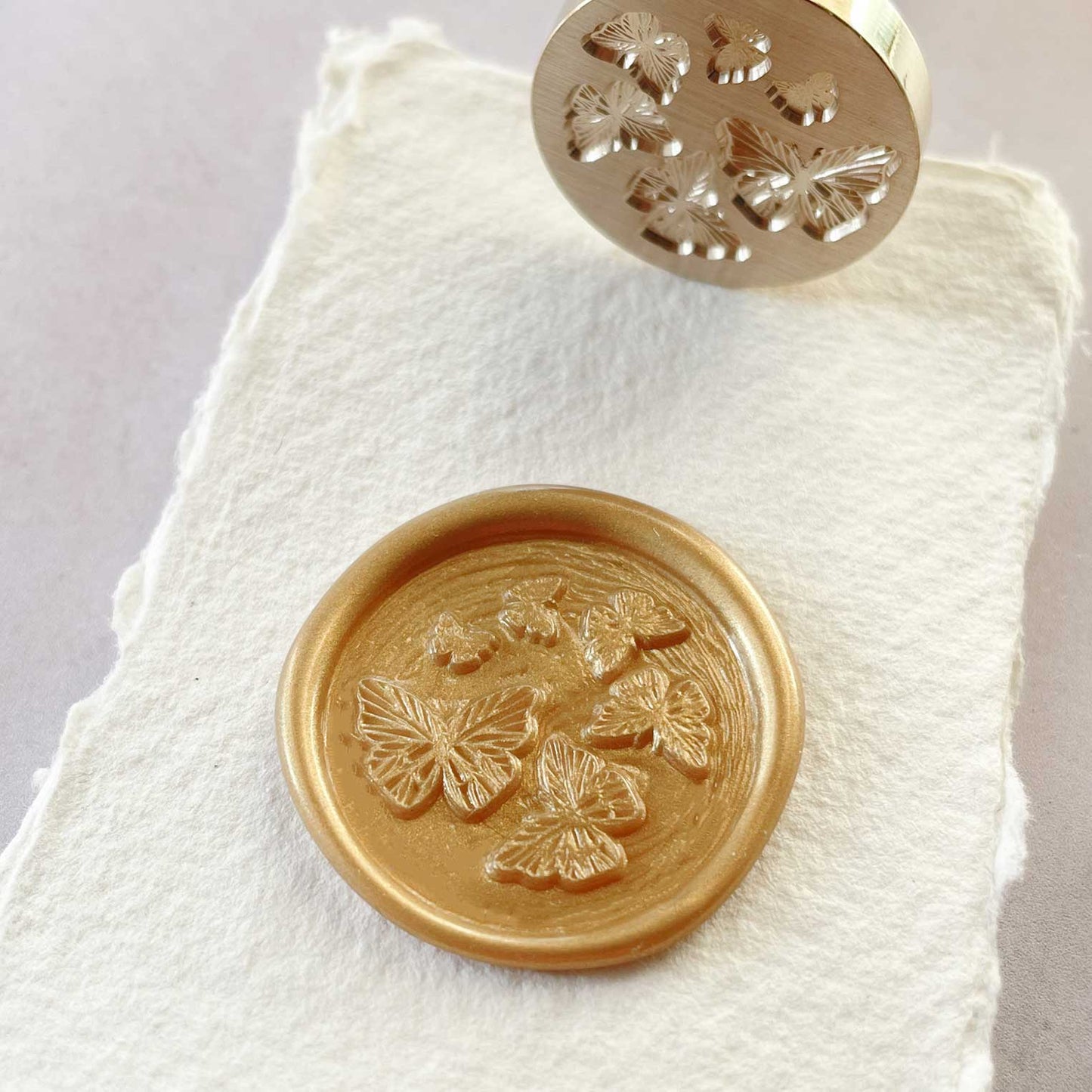 Butterfly design wax seal stamp.  Sealing wax stamp with flying butterflies.  Perfect for decorating envelopes, invitations, stationery and packaging.  by The Natural Paper Company