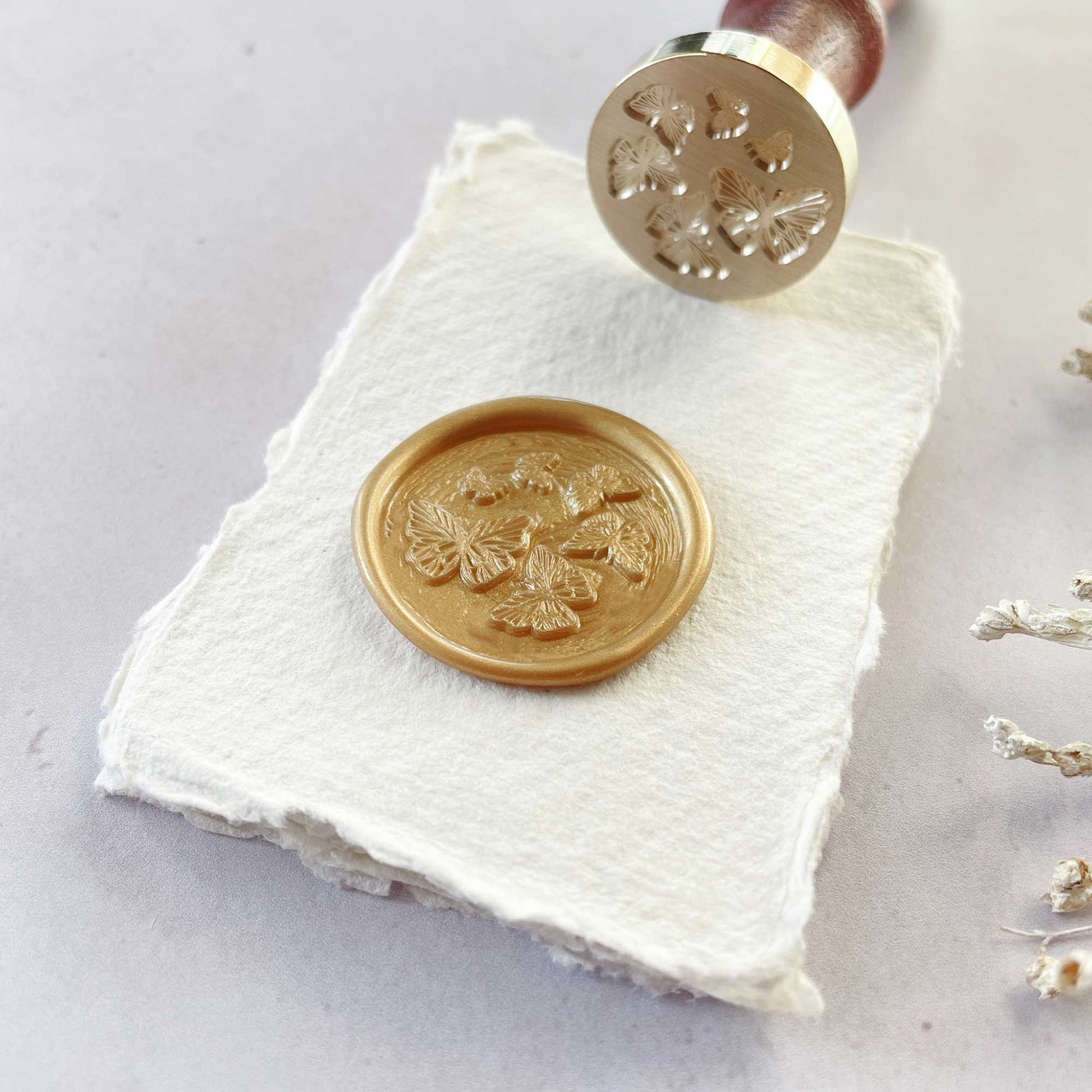 Flutterby wax stamp by The Natural Paper Company.   Make wax seals with a butterfly design