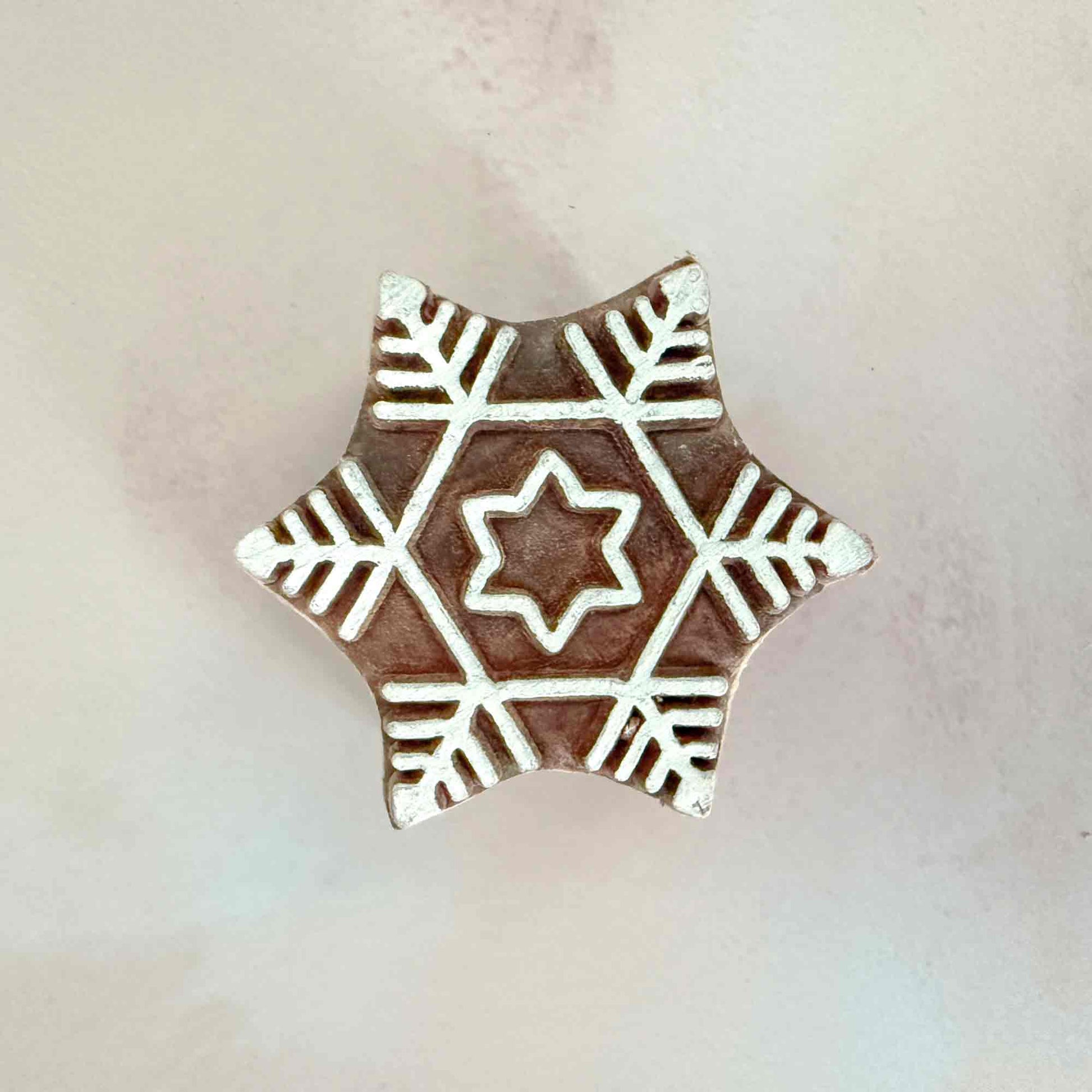 Decorative wooden stamp with snowflake pattern 